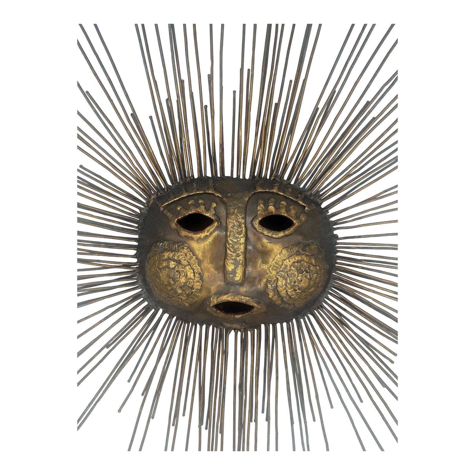 20thC Rare Emaus Talleres Signed Brutalist Mid-Century Modern Sun Face Sculpture: This item is a rare Mexican Mid-Century Modern sun sculpture crafted by Emaus Talleres Monasticos. It features a bronze face with radiating brass rod rays. Brutalist style surrealist design depicting