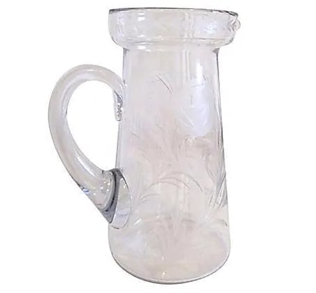 Mid-Century Crystal Etched Carnations Pitcher: Beautiful mid-century crystal handled pitcher featuring deeply etched design of delicate leaves and carnations around perimeter. Perfect for serving cocktails or everyday beverages. Condition: