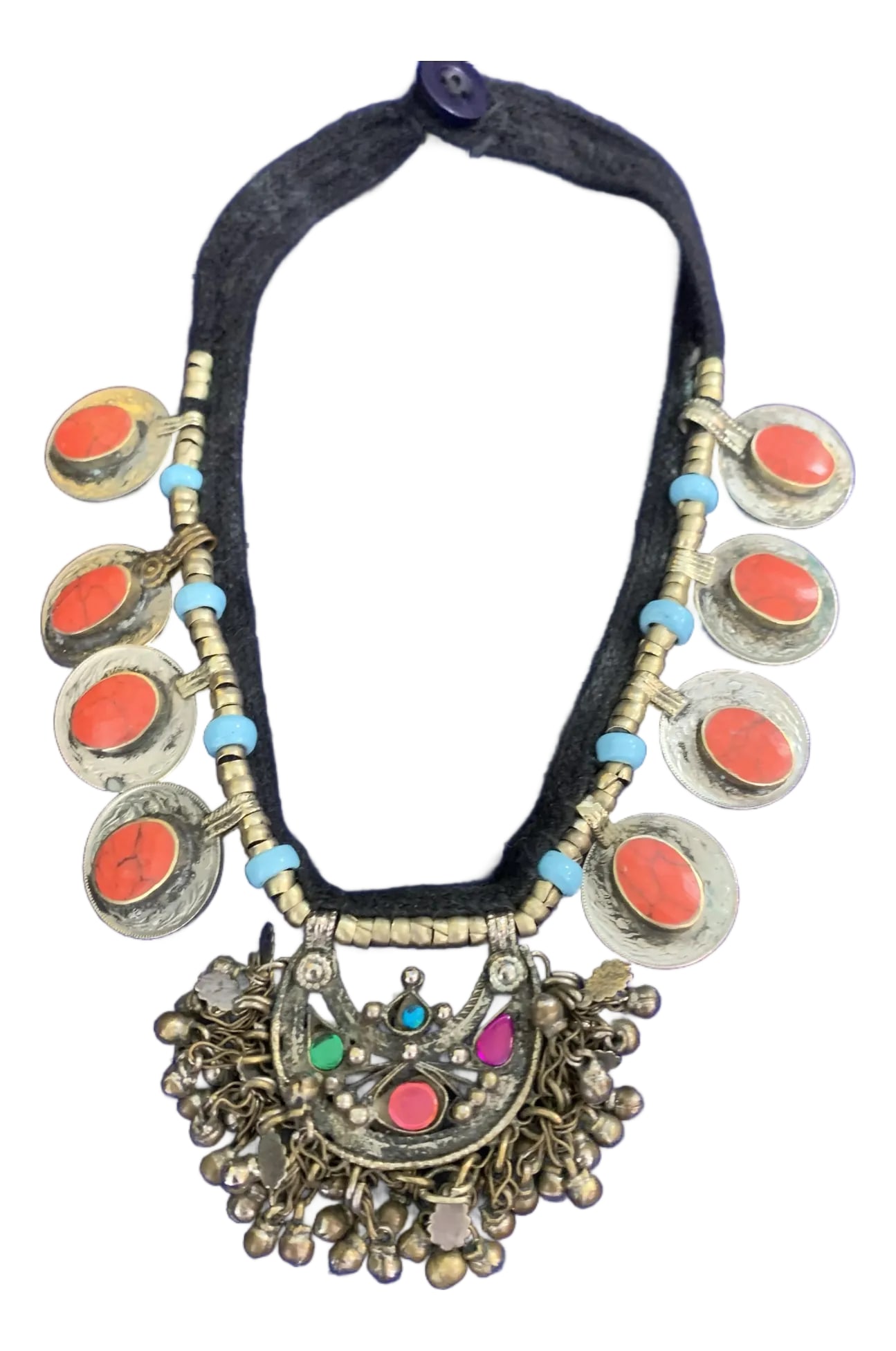Mid 20th Century Afghan Tribal Kuchi Pendant Necklace Boho Jewelry Made With Coral and Turquoise: This Afghan Tribal Kuchi Pendant Necklace is a striking piece of bohemian jewelry, showcasing a round coral stone set in silver-plated metal. Inspired by traditional Middle Eastern and Central Asian d