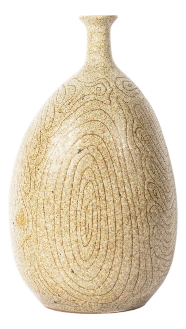 Signed Studio Pottery Vase by Frederick Carlton Ball: A studio pottery vase by American artist Frederick Carlton Ball (1911-1992). This neutral-colored bottle-shaped vase features an abstract pattern to the exterior and a narrow neck. It is signed "FC