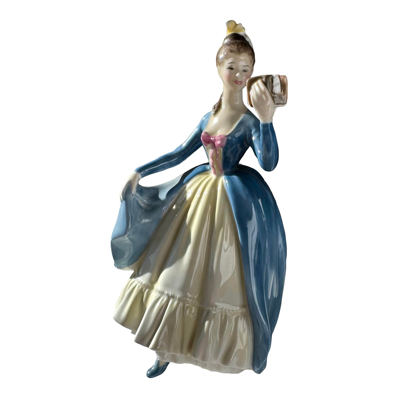 1956 Royal Doulton Figurine ~ "Leading Lady" ~ Hn 2269: "Leading Lady" (H.N. 2269), introduced by Royal Doulton in 1956, is a finely modeled bone china figurine from the H.N. series. The piece depicts a young woman in a graceful, upright pose, her gown scu