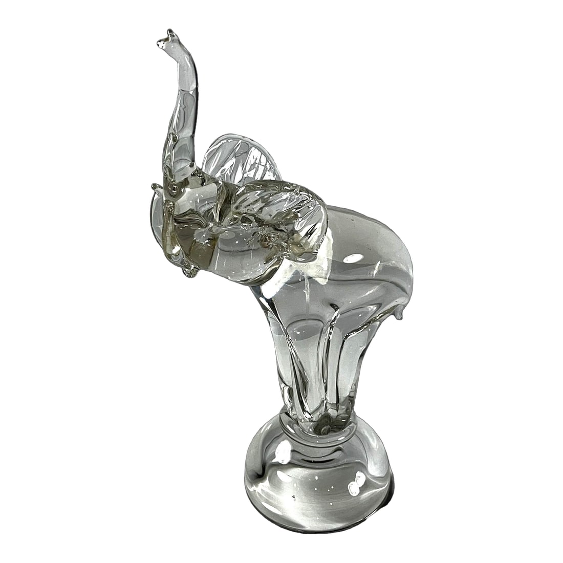 Late 20th Century Clear Art Glass Elephant Sculpture With Raised Trunk Attributed to Murano: This clear art glass elephant sculpture is likely from Italian glassmaking traditions, particularly those of Murano , Italy. The piece features the distinctive raised trunk position, which in many cul