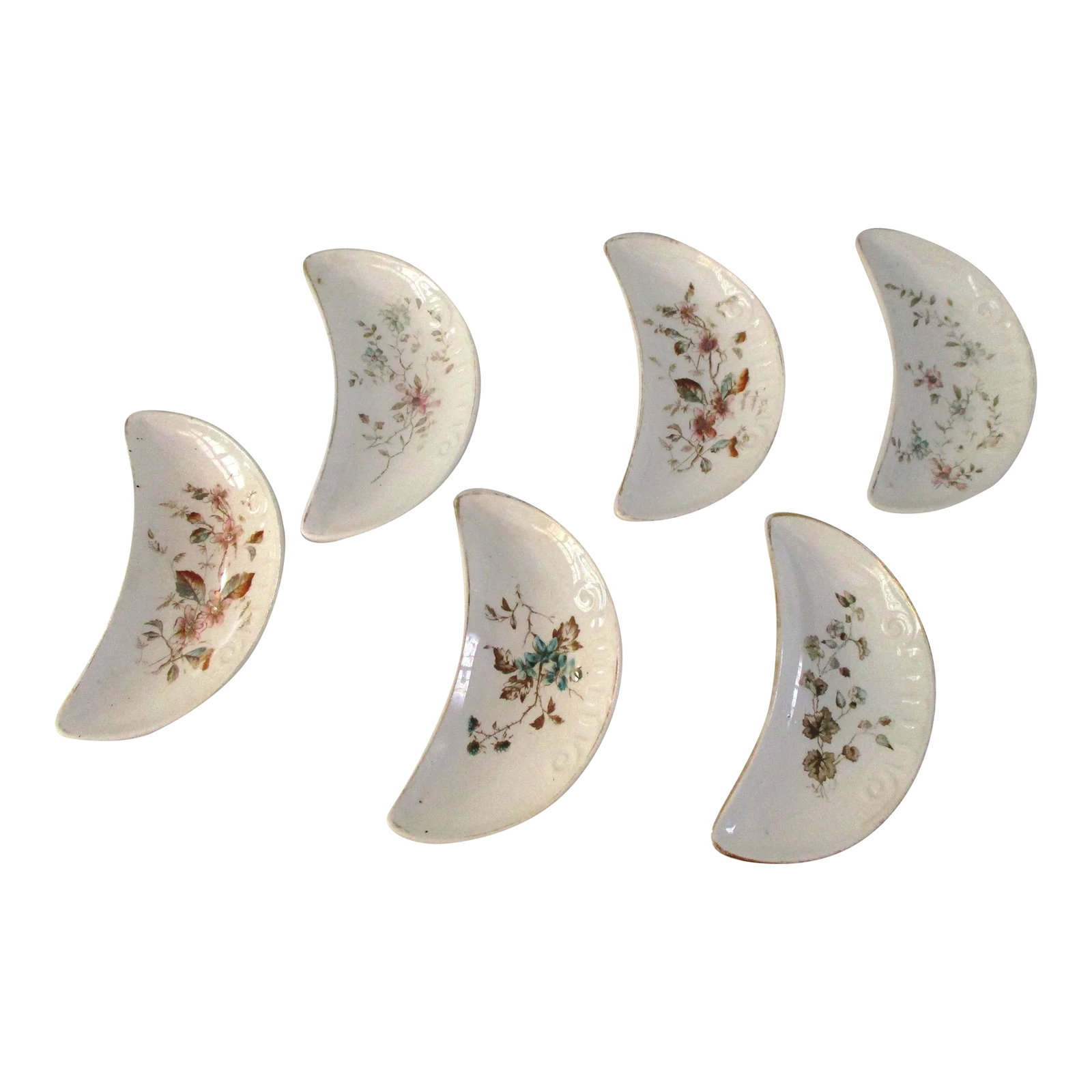 Antique English Bone Dishes, Set of 6: Pretty set of six antique English stoneware bone dishes in a multi-color delicate floral motif. Due to age of dishes, (1900-1910), there is gold loss to rims and crazing. Old English beauty and