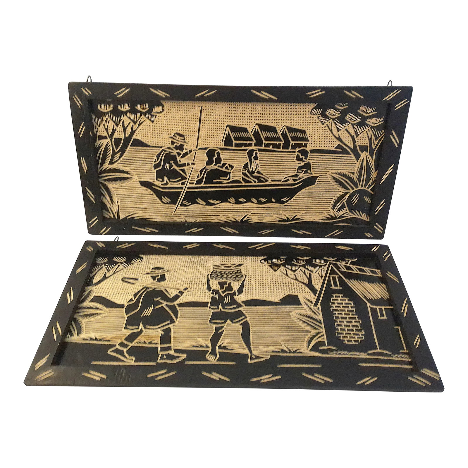 Mid-Century South American Etched Wood Plaques, a Pair: Mid-century pair of dark wood South American wall plaques each featuring a nicely done etched scene of island village life. Loops at top of each plaque for wall display. Excellent condition. Condition
