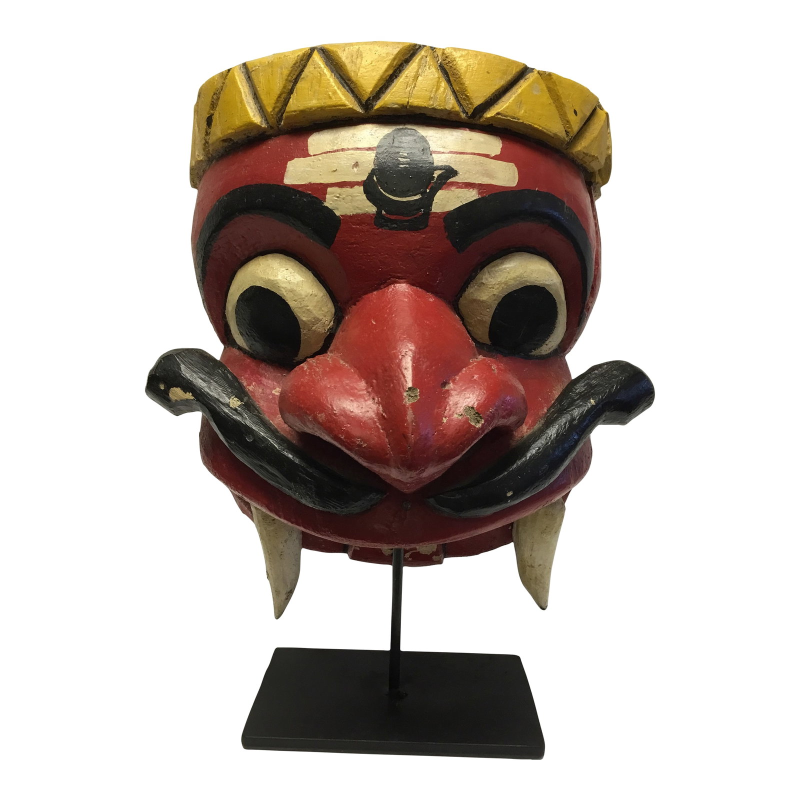 Wooden Mask on Base Red and Yellow: Our mounted mask will add culture and character to any room. Hand-carved wood, detailed features, great colors. Metal stem and base Condition: Alterations: Original Condition Unaltered Imperfections: