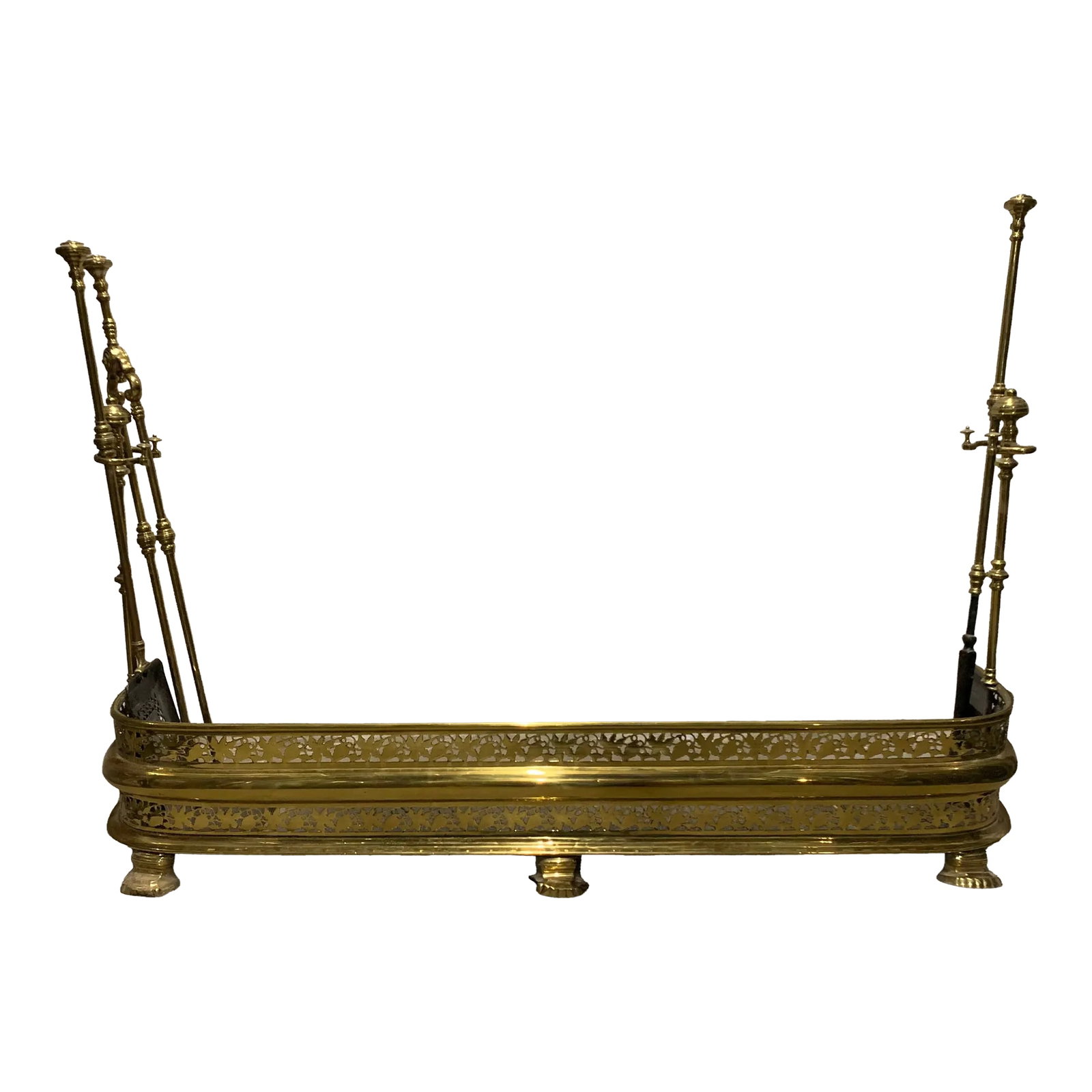 Vintage Art Nouveau Brass Fireplace Set: Vintage art nouveau brass fireplace set. The fender is a brass cut out in the art nouveau style. The set also includes the two solid brass posts for the tools, a poker, a dust pan, and tongs for