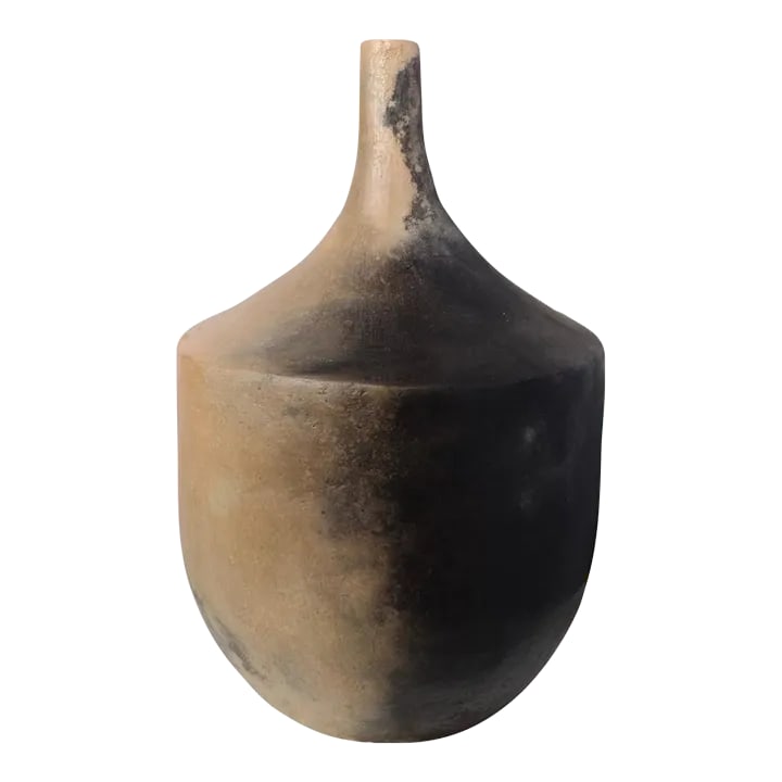 Gafsa Long-Necked Earthenware Vessel: In Northern Tunisia, the women of the Sejnane region have inherited a craft handed down from generation to generation, mother to daughter, passed down for thousands of years. These clay motifs exhibit