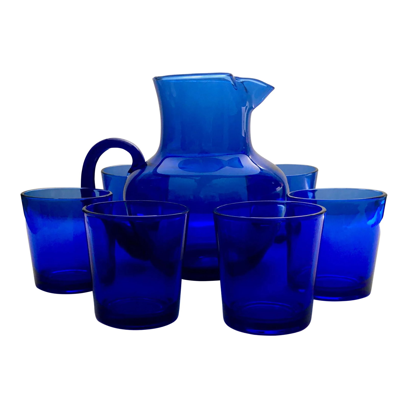 Libbey Blue Glass Drinks Service- 1 Pitcher & Six Lowball Glasses: A beautiful set of cobalt blue glassware which includes six short glasses which hold eight ounces each and a pitcher with a low handle at its side and an ice lip for ease of pouring. -Pitcher