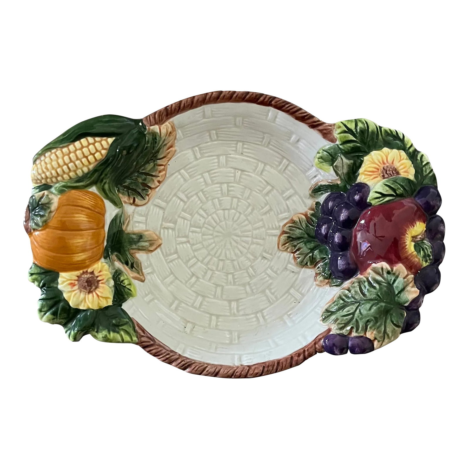1980s Majolica Style Pottery Decorative Plate- Italy: Italian Majolica pottery is so gorgeous. That classic basketweave pattern will grace any seasonal tabletop! I find this one unique in that in encapsulates so many elements; floral detailing, fruits,