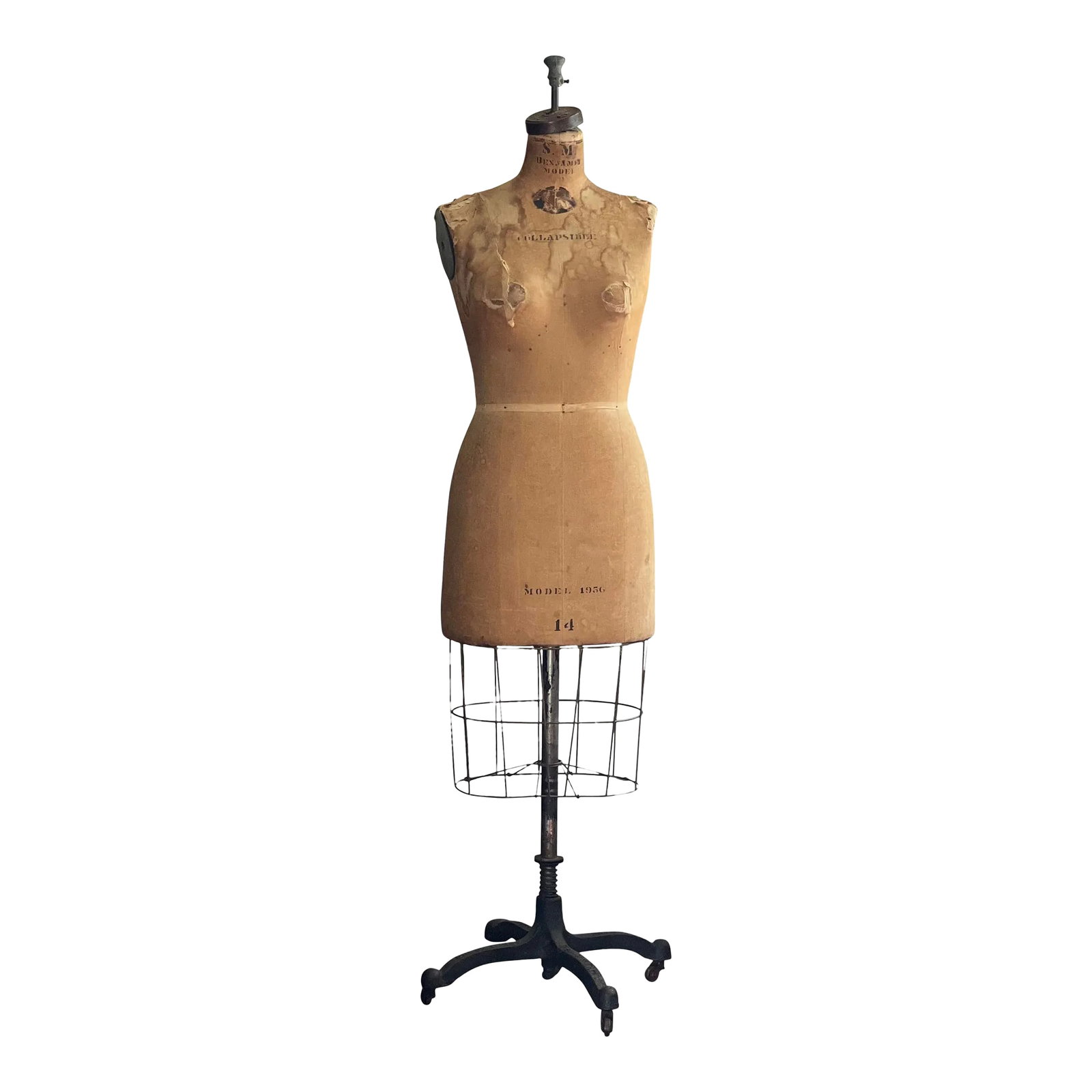 Vintage Original Wolf 1956 Dress Form Mannequin: Vintage original Wolf 1956 dress form mannequin, New York. Well worn Benjamin model dress form mannequin in size 14 on a cast iron base with casters. The form is wrapped in linen and layered with cott