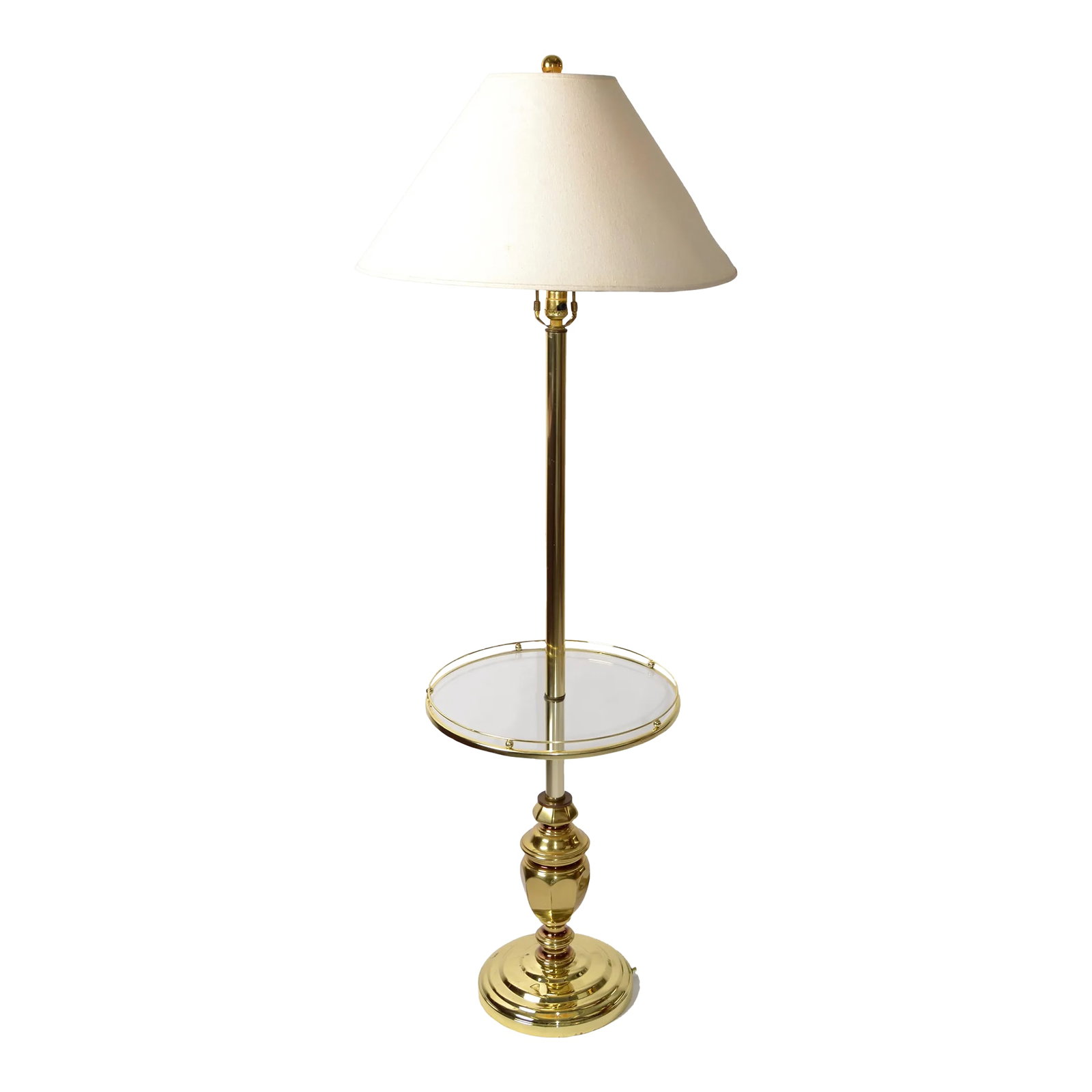 1980s Neoclassical Brass Metal Laurel Lamp Company Style Round Glass Side Table Floor Lamp: Vintage Brass and Brass Finish Metal round Glass side table floor lamp in the Style of Laurel Lamp Company. Features a cast metal round base in brass finish, Solid Brass Urn Shape Core with stem and r