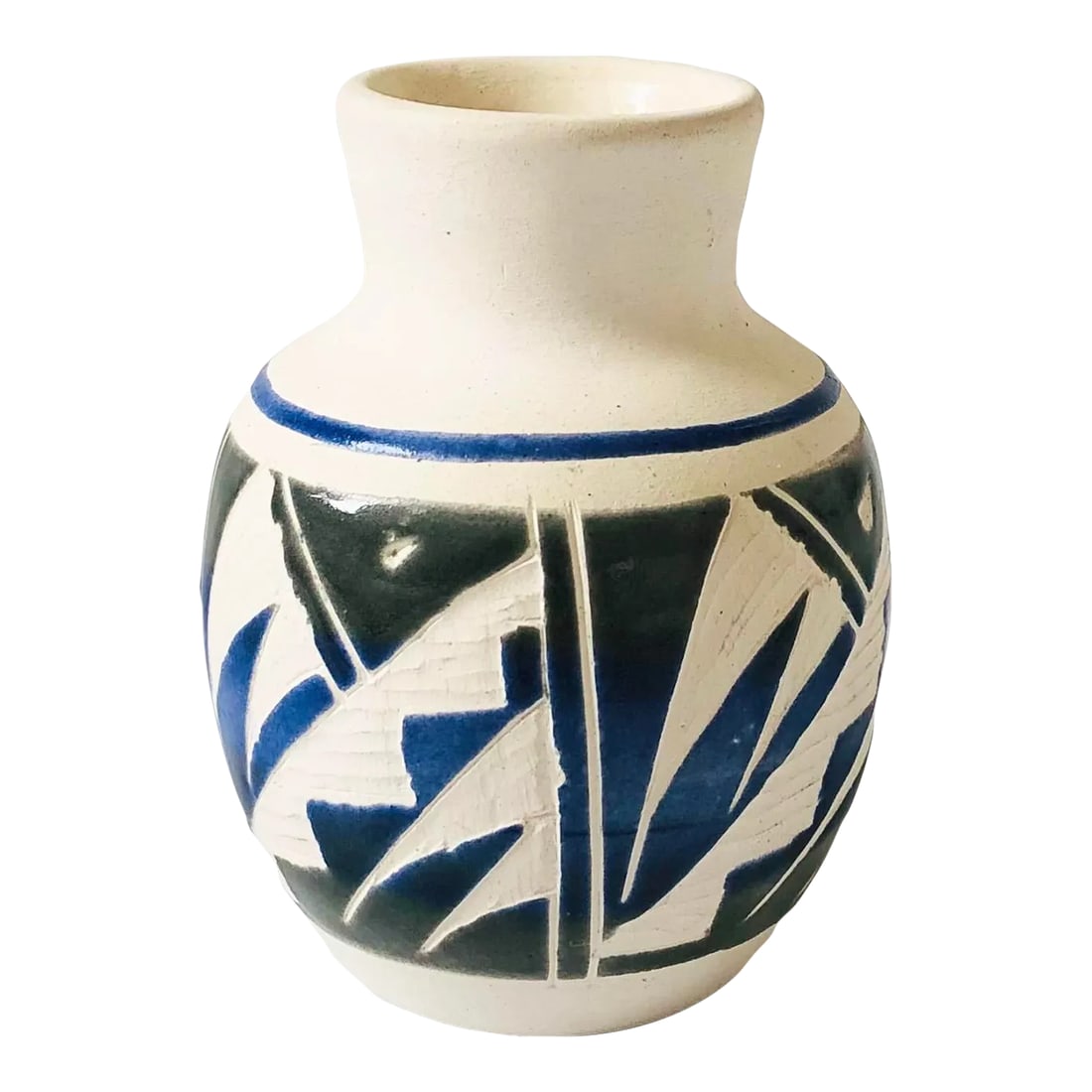 Carved Mexican Pottery Vase: A vintage carved pottery bud vase. Matte white with glossy blue and green glazes and a geometric pattern that has been hand carved into the sides of the vase. Made in Mexico, marked on the base. Condi
