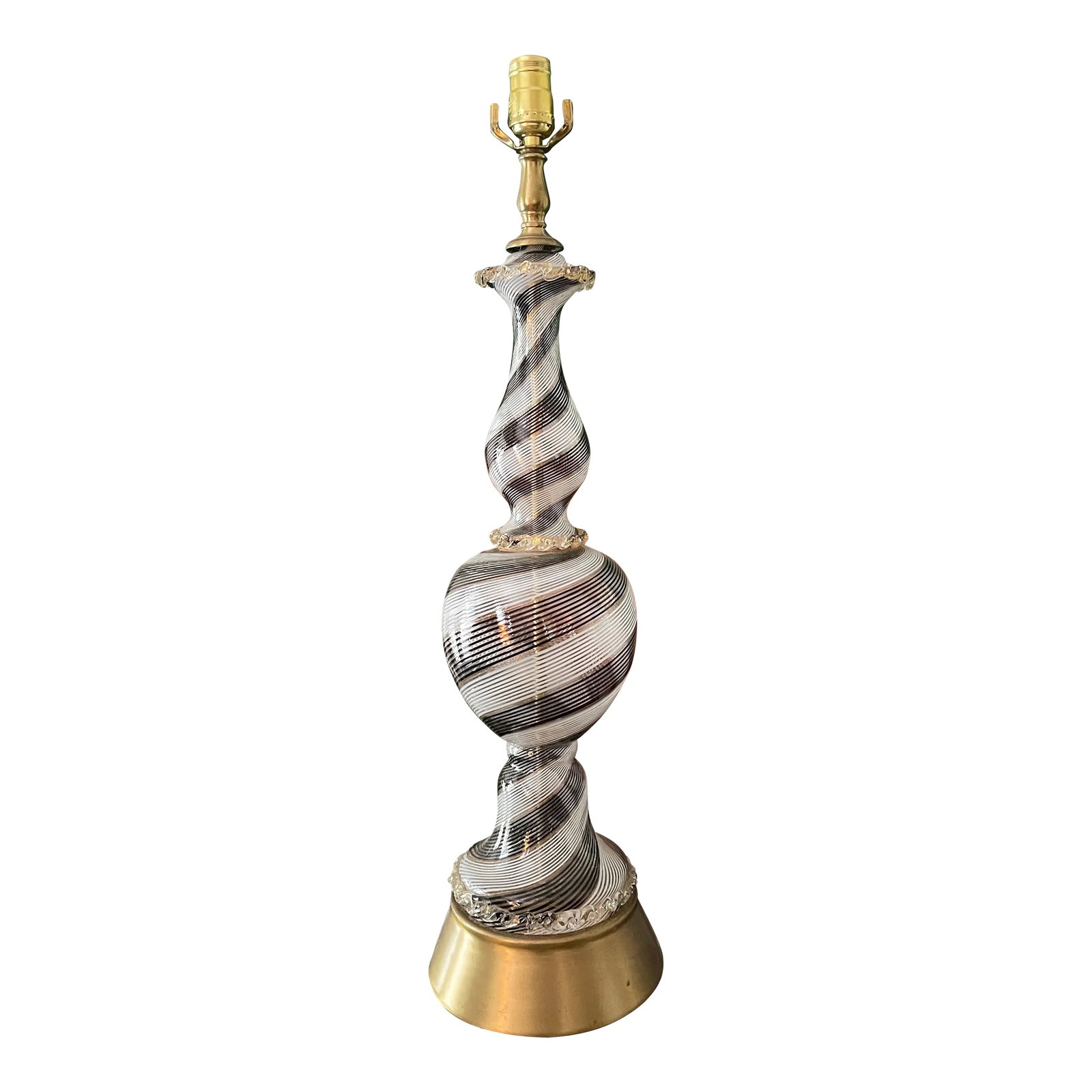Vintage Black and White Striped Murano Glass Lamp: Gorgeous hand blown glass lamp in a black and white stripe with thin metallic gold accent. The lamp was made in sections and then assembled into this lamp. The base is brass. The lamp is on the