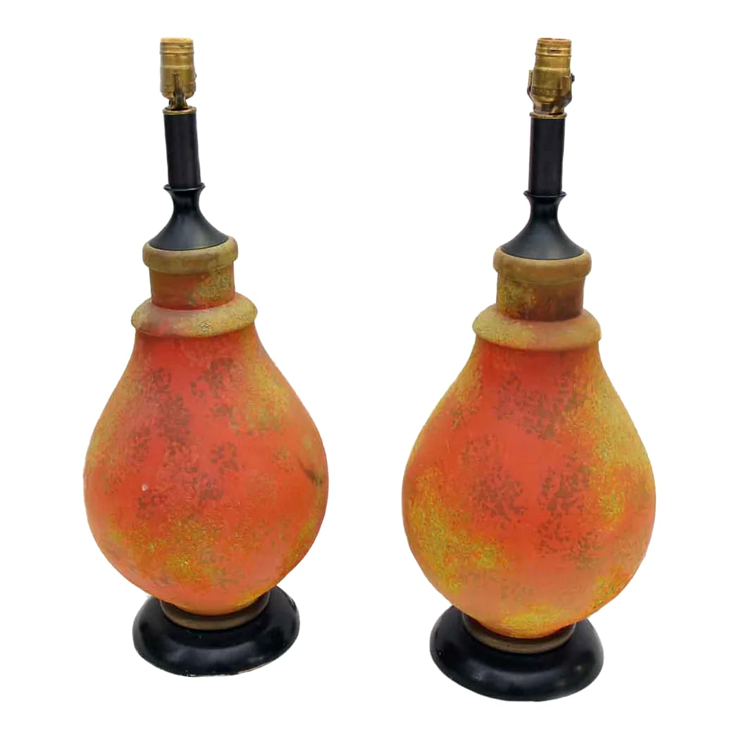 Pair of 1970s Mid Century Orange Glass Table Lamps: Vintage orange mixed glass lamps from the 1970s. They are in good condition. Each lamp requires one bulb. Priced as a pair. These lights are wired, ready to ship. The manufacturer and exact date of cr