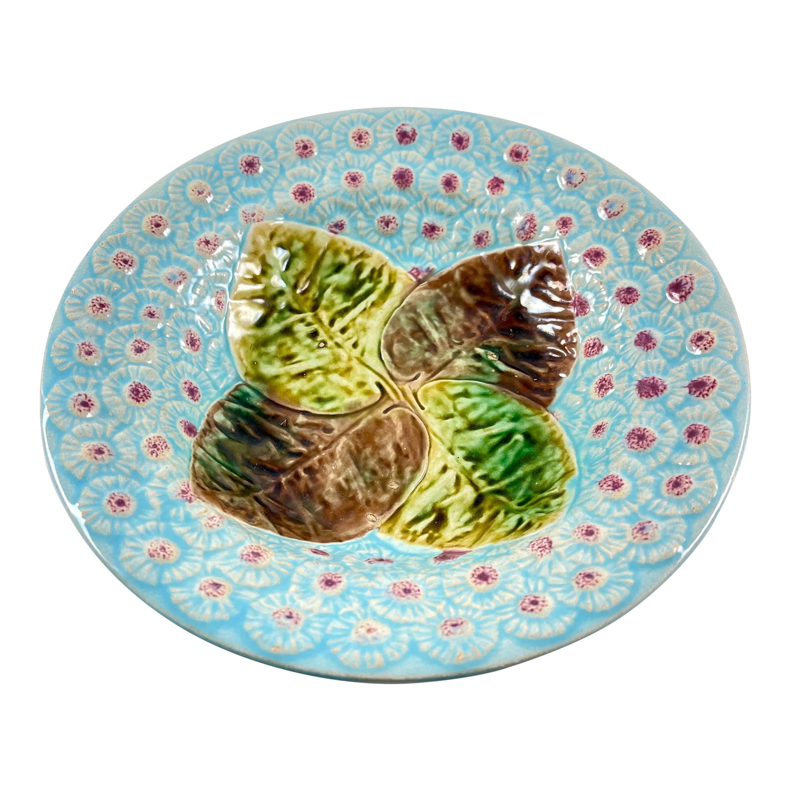 Joseph Holdcroft English Majolica Leaf & Dandelion Majolica Bowl, Circa 1870: An English majolica Leaf and Dandelion floral bowl by Joseph Holdcroft, Circa 1870. Designed in the Aesthetic taste, four overlapping leaves, glazed in the colors of Autumn, are centered on a deep