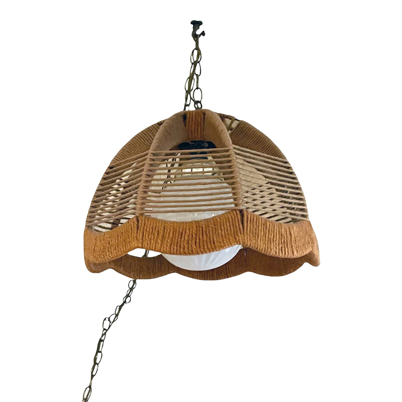 1960's Hemp Rope Swag Light: Eye-catching vintage rope pendant light. This midcentury suspension lamp features a dome, canopy shaped rope covered shade. It hangs from a chain ended by a rope covered canopy. The length of the chai