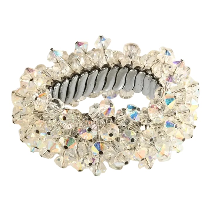 1950s Vintage Crystal Beads Cha Cha Expansion Bracelet: This is part of Chairish's Costume Jewelry assortment. Unmarked expansion bracelet comprised of faceted crystal beads in two different shapes some of which have an iridescent finish. This is a large