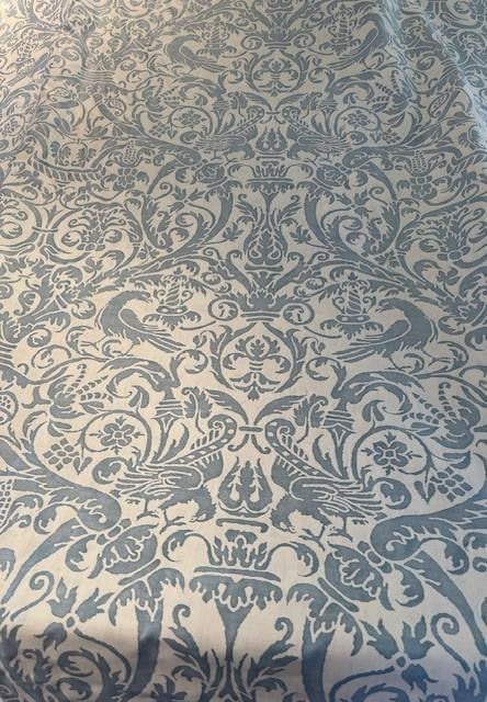 17th Century French Design Fortuny Fabric in Azule Blue and Antique White- 4.5 Yards: Detailed with flowers, foliage and bird motif in Azule Blue and Antique White, (UCCELLI 5309) this 17th Century design on fabric comes to life. Made with 100% Cotton, Fortuny Fabric bellies with