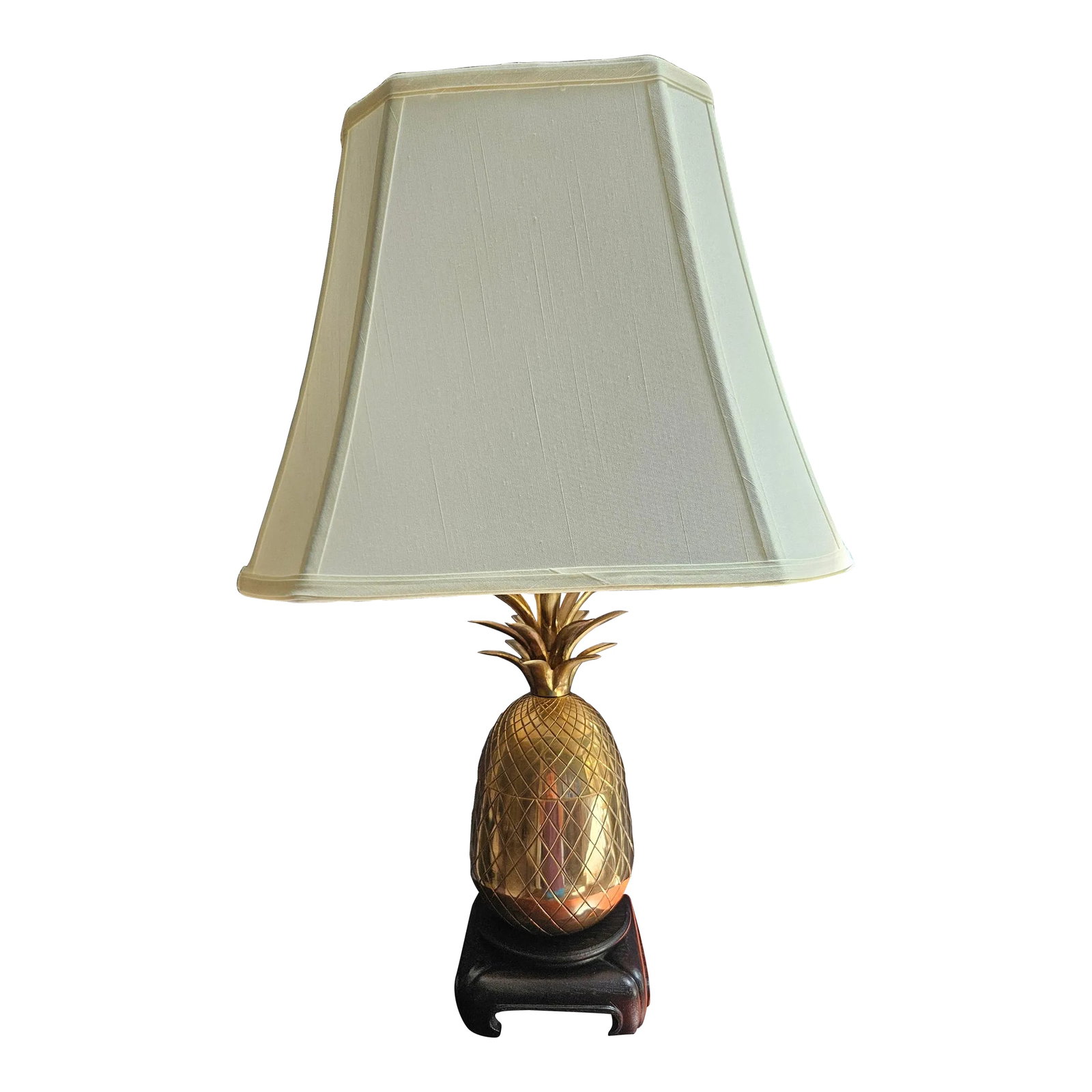 Brass Pineapple Lamp: This beautiful brass pineapple lamp will add a unique flair to your home. The pineapple is the symbol of hospitality in early America. May be Frederick Cooper but there is no label. Shade is included 
