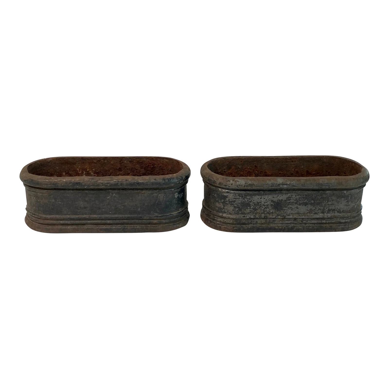 Antique French Cast Iron Jardinieres Planters - A Pair: Sourced in France, this stunning pair of black cast iron oblong planters have the age and patina we always search for. The walls are about one inch thick and there is iron residue in the interiors, ob