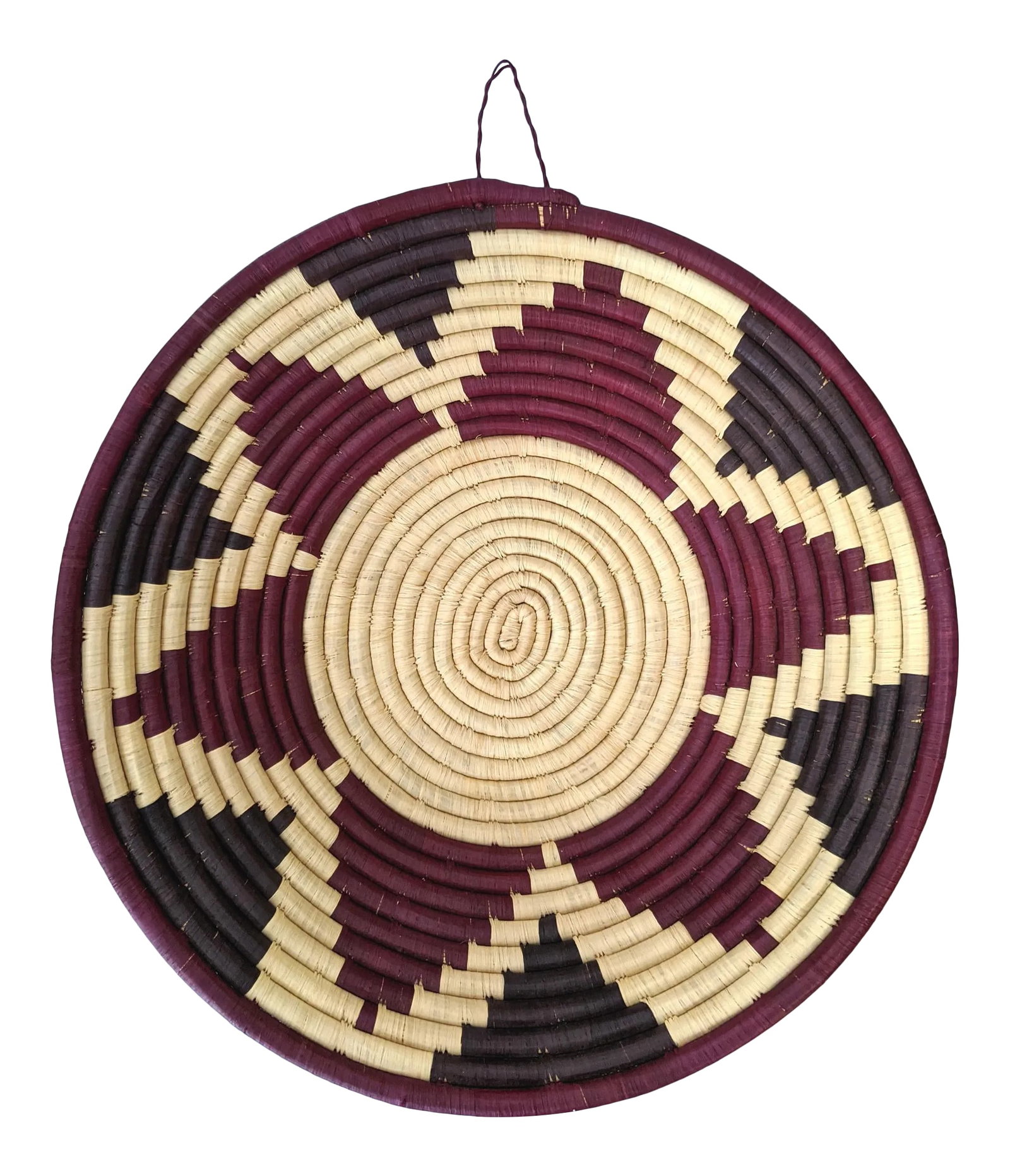 1990s Coiled Artisanal Rwandan Basket: A stunning, artisanal coiled basket in hues of oxblood, eggplant and cream. Using traditional methods, Rwandan craftswomen weave beautifully dyed sisal fibers and sweet grass to make these gorgeous ba