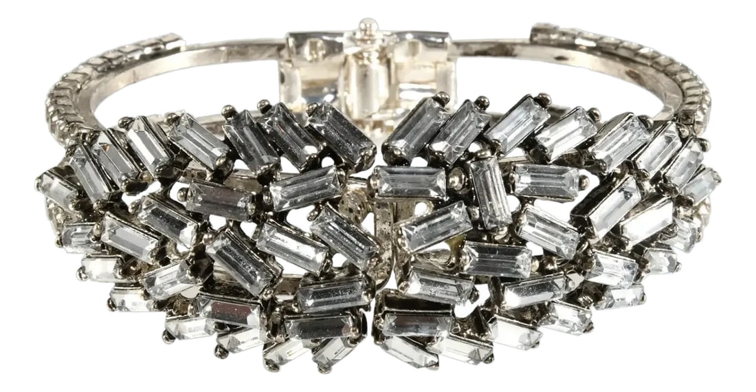 Vintage Lorren Bell Hinged Clamper Bangle Bracelet Clear Baguette Rhinestones: Hinged Clamper bracelet by designer Lorren Bell. Decorated with a bevy of clear baguette rhinestones. Metal is silver in color. We believe this piece dates to the early 2000s although Lorren Bell