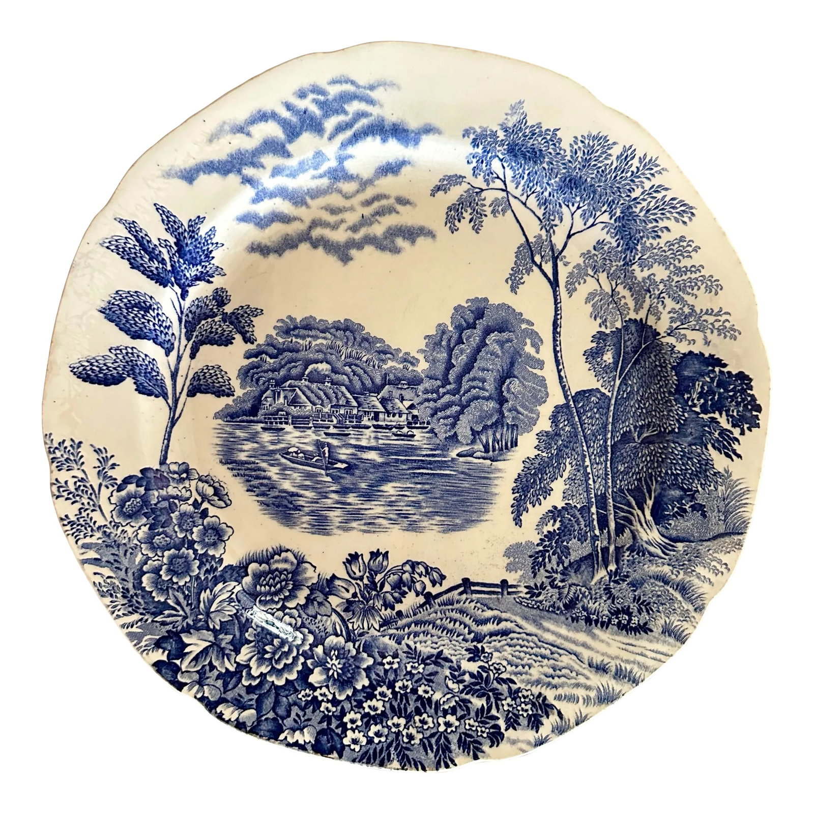 Vintage Pountney & Co the Thames at Pangbourne Blue White Plate: This decorative plate from Pountney & Co Ltd features a beautiful blue willow pattern on a round ceramic plate with a diameter of 10.375 in diameter. The plate is finished with a glossy look and is