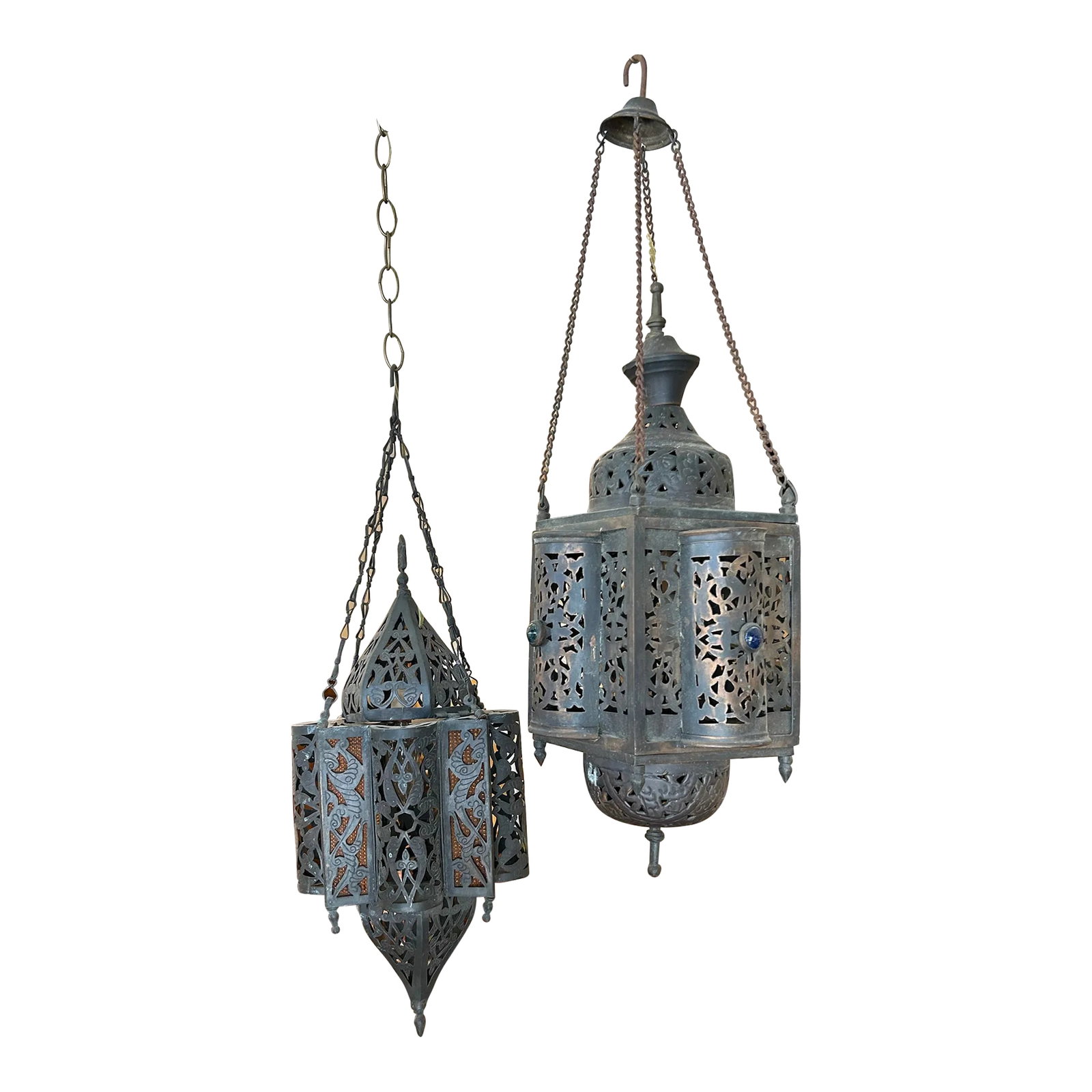 Pair of Antique 1920s Moroccan Copper Pendants: Antique Moroccan pendants handcrafted in copper with colored glass highlights having a timeworn patina. Condition: Alterations: Original Condition Unaltered Imperfections: Some Imperfections Condition