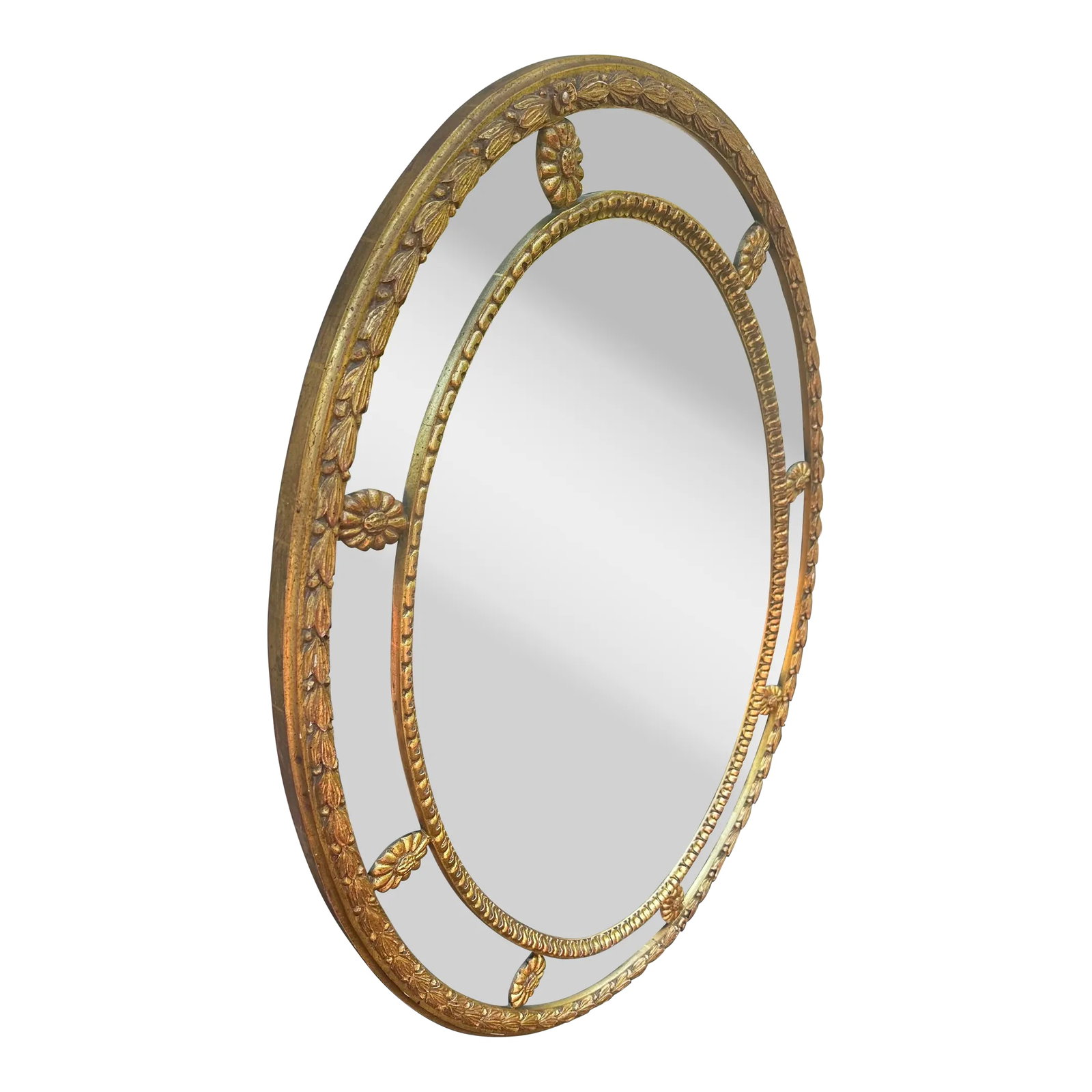 Mirror Fair Carved Oval Giltwood Mirror by Stephen Cavallo: The handcrafted mirror by Stephen Cavallo/Mirror Fair, with oval mirror plate set within a decorative wood frame with gilt finish, featuring carved florettes and leaf/vine borders. Condition: