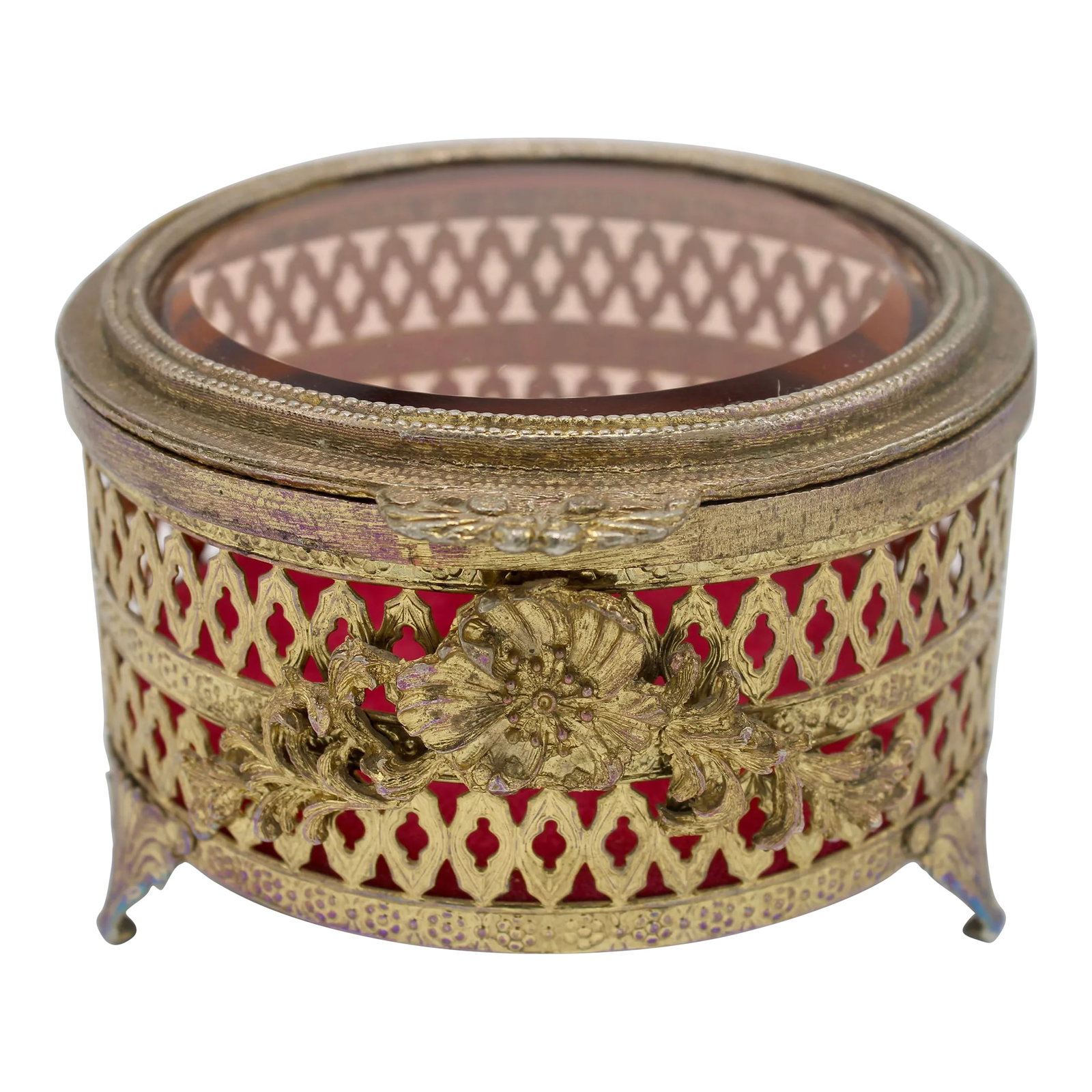 Antique French Brass and Glass Casket Jewelry Box: A lovely antique French jewelry box, circa 1920. The lid has thick beveled glass that has a light pink tint. The brass floral motif and geometric pattern is stunning. Condition: Alterations: Original 