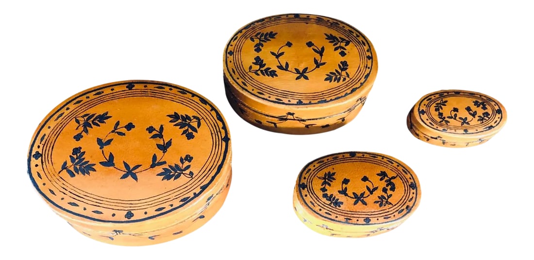 Vintage 1990s Lacquered Nesting Boxes - Set of 4: Fabulous vintage set of four lacquered oval nesting boxes. Exteriors of the boxes are wrapped in a warm, dark camel shade of lacquered material which presents as leather. Fine stitching encircles both