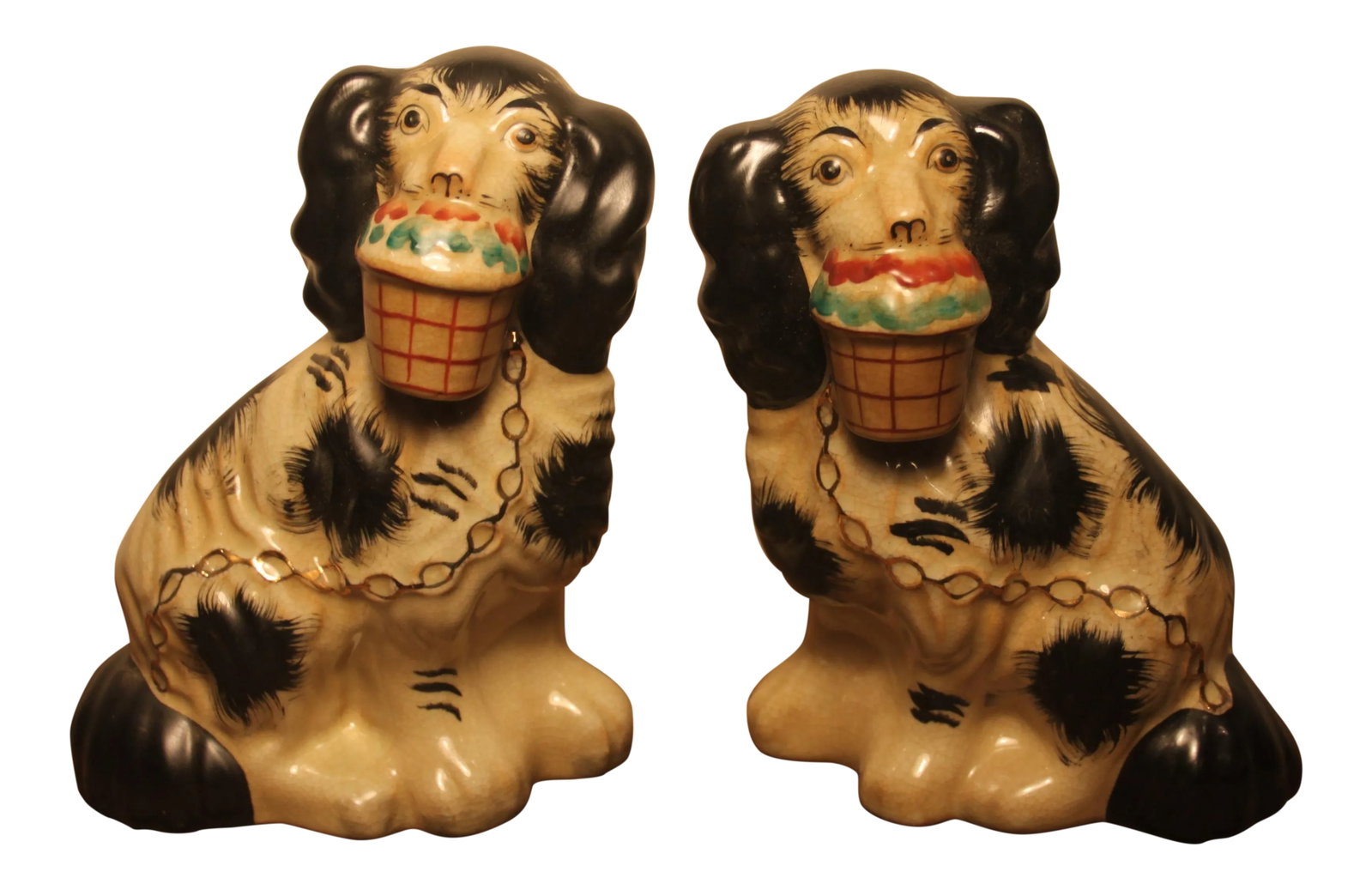 Early 20th Century Staffordshire Black and White Dog Figurines- A Pair: Vintage pair of Staffordshire dog figurines. Hand painted black spots and basket flowers with gilt detailing in the collar and chain. Condition: Alterations: Original Condition Unaltered
