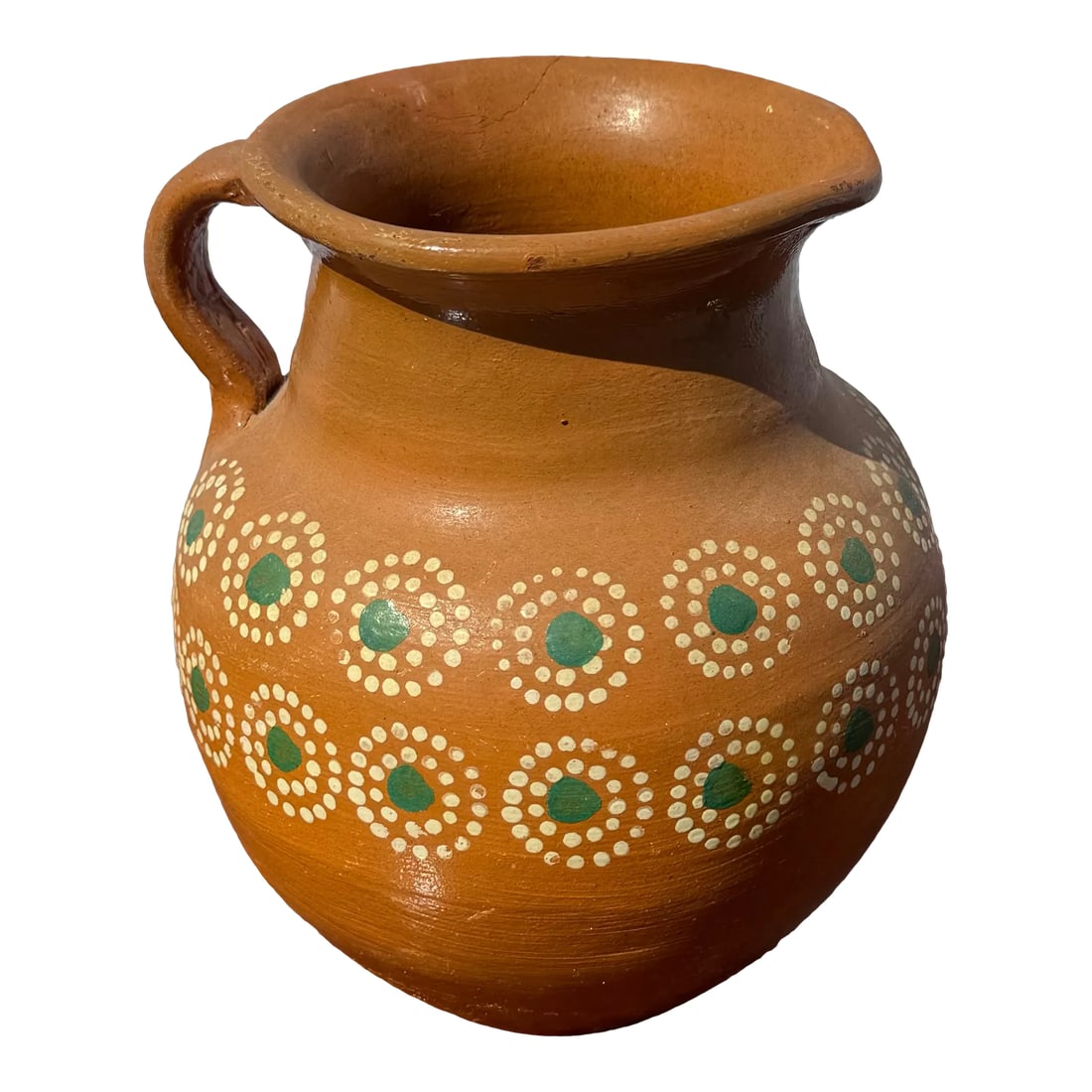 Vintage Painted Terracotta Pitcher From Mexico: This vintage Mexican terracotta pitcher showcases a traditional hand-painted dot pattern, embodying the rustic charm and cultural heritage of Mexican folk art. Its warm earthy tones and unique design