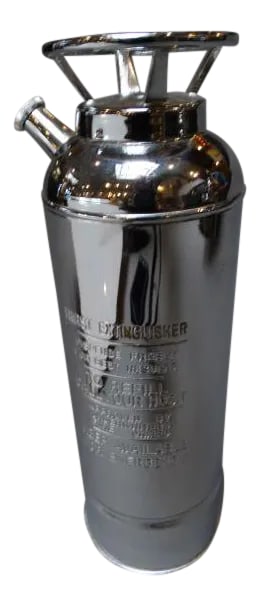 Mid 20th Century Novelty "Fire Extinguisher" Music Box Cocktail Shaker: A Thirst Extinguisher! Novelty Japanese-made cocktail shaker with a music box which plays "How Dry I Am." Perfect. 12" x 4" x 4". Condition: Alterations: Original Condition Unaltered Imperfections: