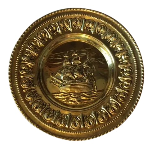 Mid Century Brass Nautical Wall Plaque: Very nice Mid-Century wall plaque/plate with brass finish. It's possible my father bought this when he was in the Navy in the 1950s. The image in the center is of a galleon ship. On the back it is
