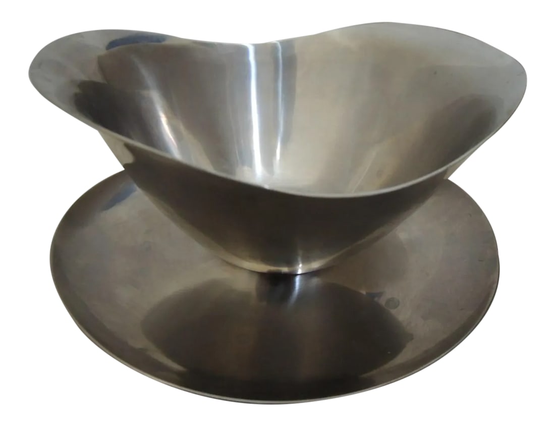Stainless Steel Gravy Bowl: Serving Dish with Attached Plate/Spoon Rest Stainless Steel Gravy Bowl Vtg 60s Japan. This vintage 1960s stainless steel gravy bowl is etched on the bottom with the words "18-8, stainless steel