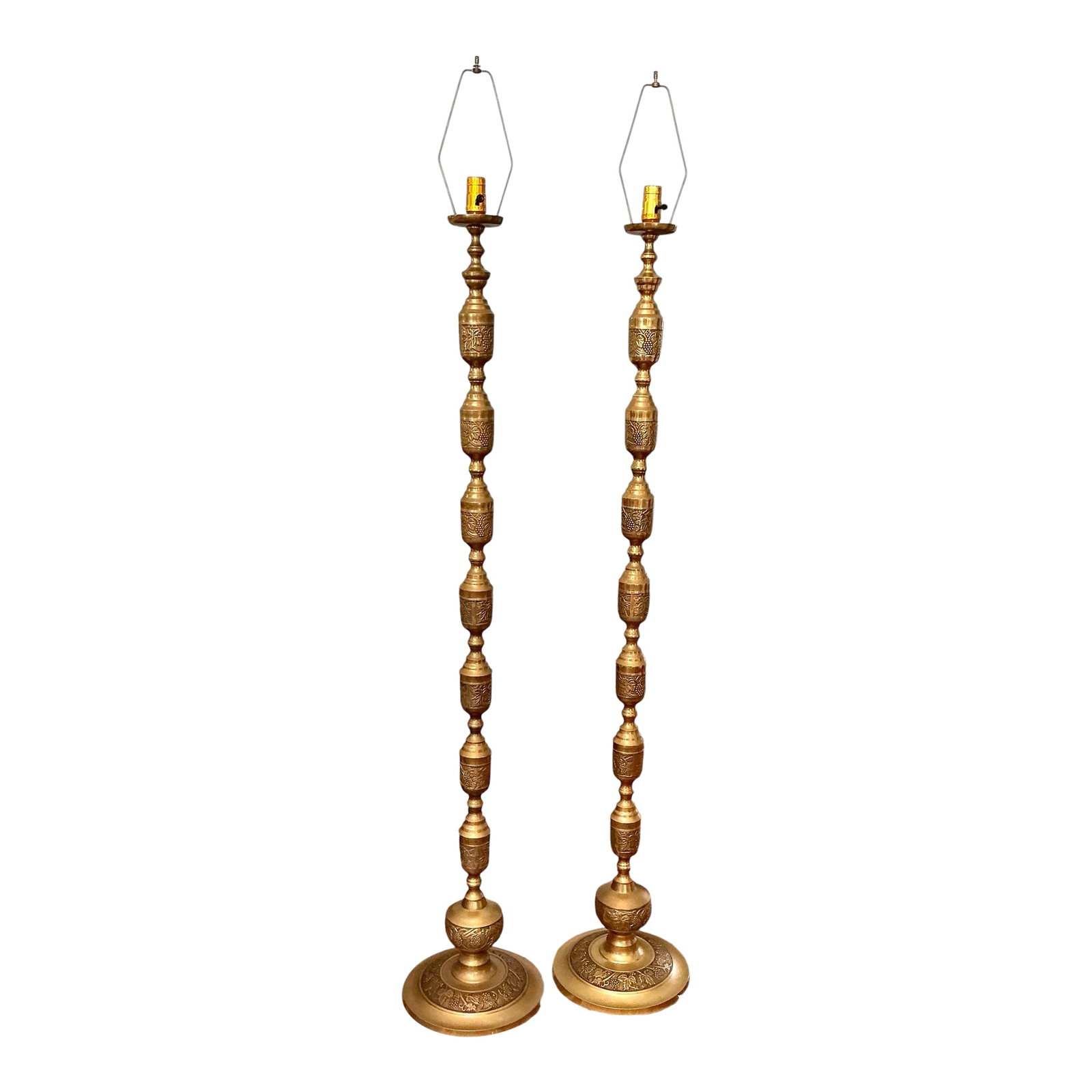 Pair of Japanese Mid-Century Brass Floor Lamps Embossed With Middle Eastern Motifs: Pair Of 1960s Japanese Mid- Century Brass Floor Lamps Embossed With Middle Eastern Motifs. Newly rewired in January 2025. This stunning pair of Mid-Century Modern Japanese brass floor lamps from the 1