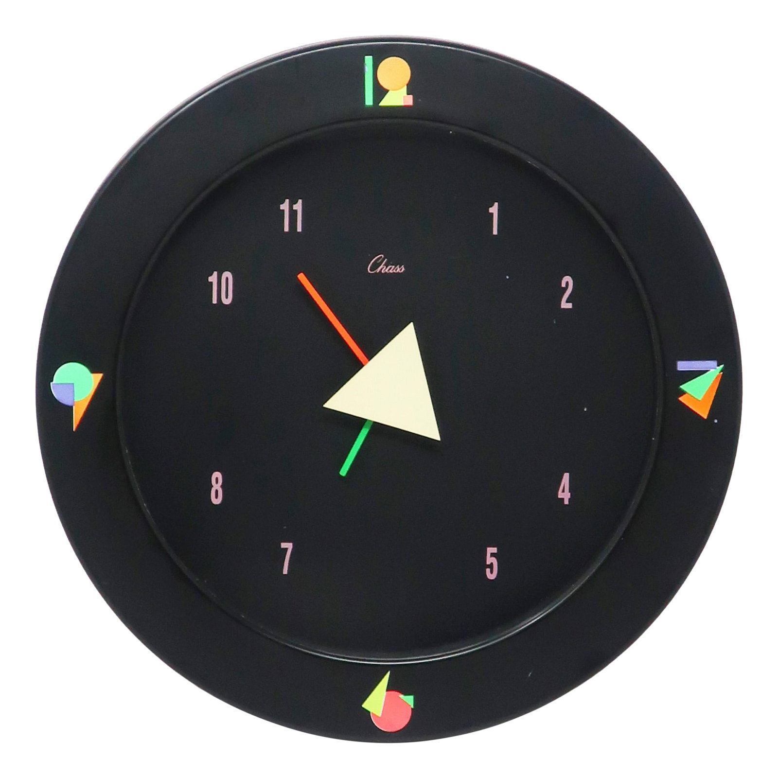 1980s Black Postmodern Wall Clock by Chass: With a vibrant 1980s touch of class, this 'Chass' Postmodern Wall Clock features a black case and face, pastel numbers, geometric accents, and an asymmetrical hand arrangement. Reminiscent of Memphis