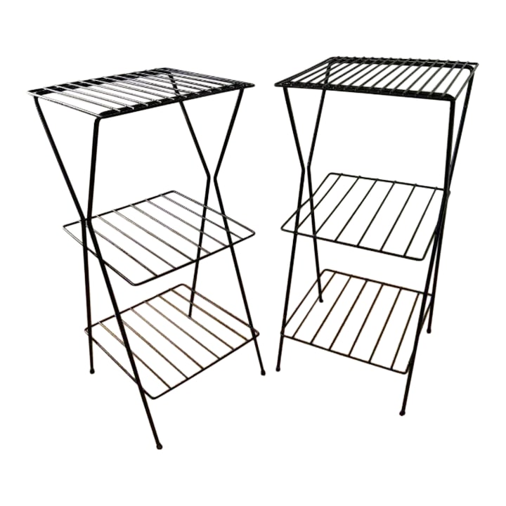 Mid-Century Modern Metal Three-Tiered Plant Stands, Pair (2): Two timeless mid-century black metal plant stands, ready to display your favorite potted plants. Each metal stand offers three square shelves with a grid pattern for stability. The sides have an