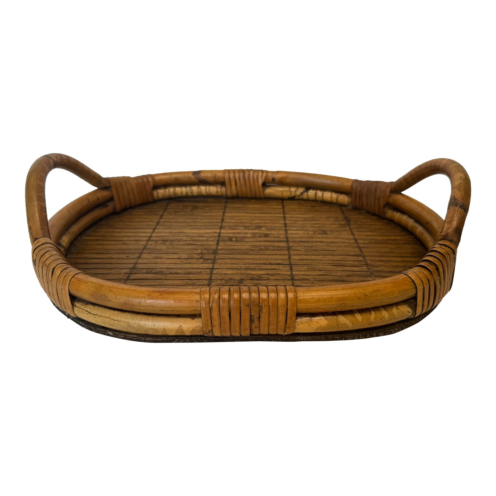Vintage Coastal Bamboo & Pencil Reed Rattan Double Handle Serving Tray in the Style of Gabriella Cre: This Coastal style bamboo and pencil reed rattan tray is a perfect size for an small entryway, bathroom or table. Its fluid oval shape consists of thick warm hone toned color bamboo with curved
