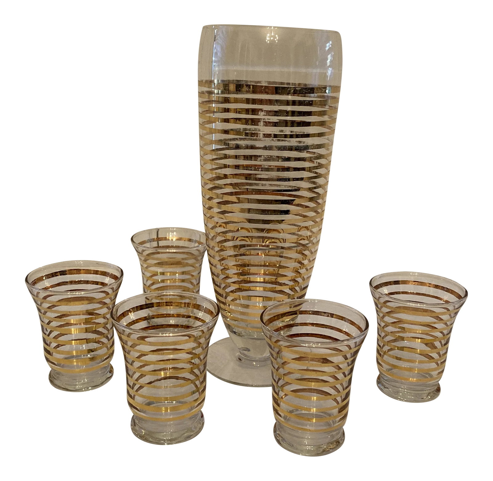 1960s Gold Banded Cocktail Set: Gold Banded Glass Cocktail set with 5 sm glasses. The cocktail pitcher has wear on the gold bands. The glasses are 2.5 inches wide and 3 inches tall Condition: Alterations: Original Condition Unaltere