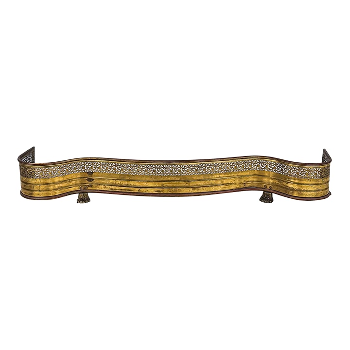Mid-Century Brass Fireplace Fender: A beautiful mid-century pierced brass fender with an excellent serpentine shape and brass feet. This is the kind of stunner sure to add an elegant and stylish finishing touch to a fireplace or