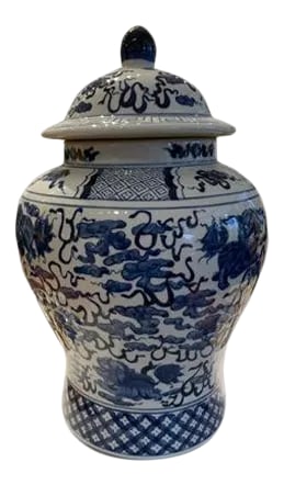 Blue and White Traditional Vase: Asian style hand painted blue and white traditional vase with a cover. It painted with Foo Dogs and flowers, and the background color is white, unmarked. Condition: Imperfections: No Imperfections