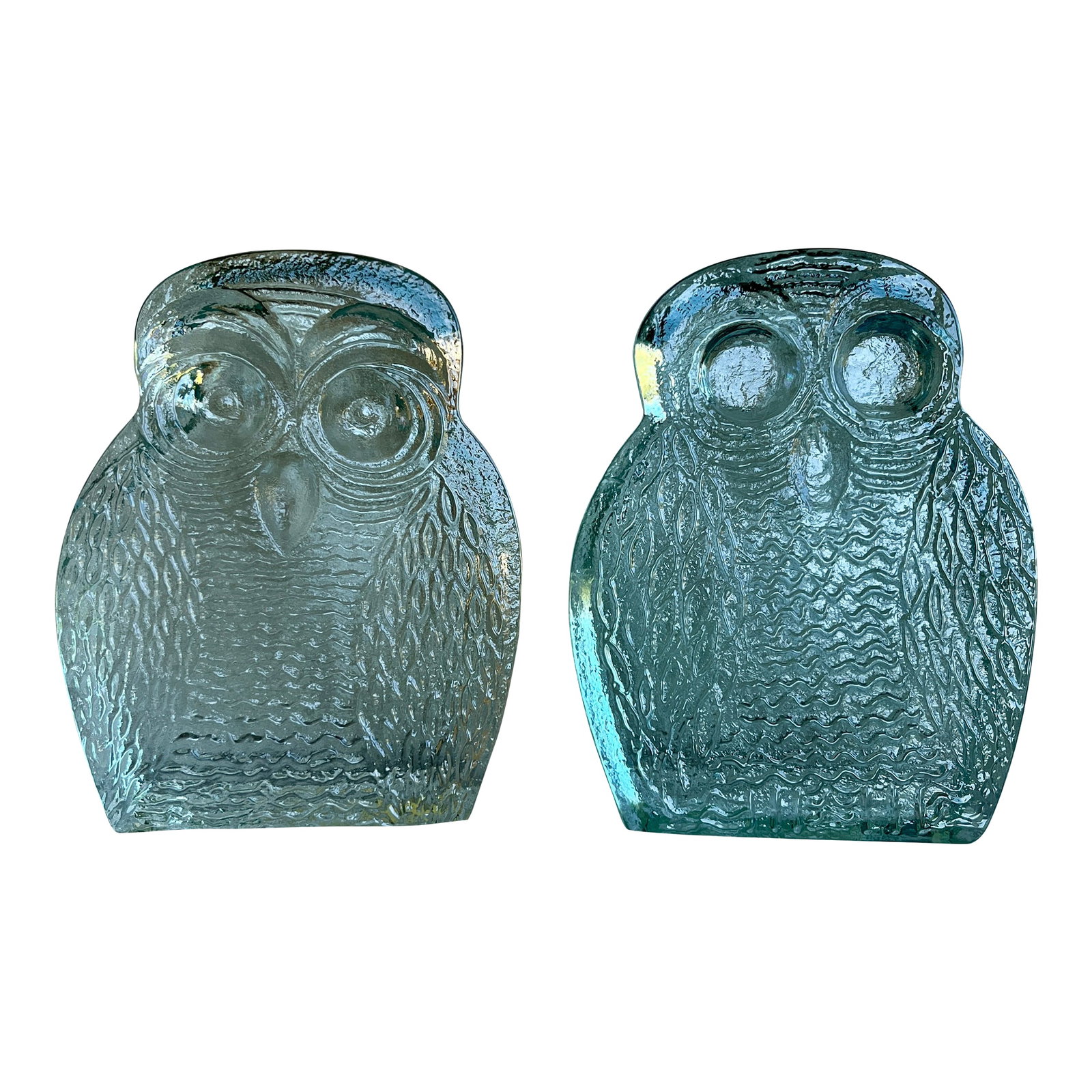 Clear Glass Blenko Owl Bookends - Mid-Century Modern: A striking pair of clear glass owl bookends by Blenko Glass Company, known for their bold, artistic designs and impeccable craftsmanship. These sculptural owls catch and refract the light beautifully,