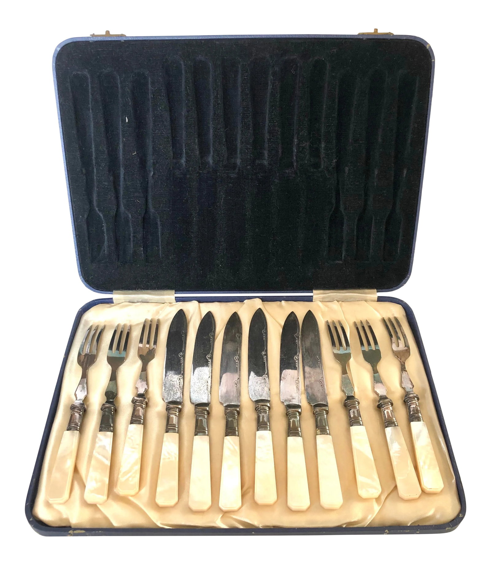 12 Piece Mother of Pearl Fruit/Dessert Set: Lovely 12 piece fruit/dessert set consisting of 6 of each knives and forks in their presentation box. Handles are of beveled mother of pearl and handle banding likely sterling yet no marks to indicate