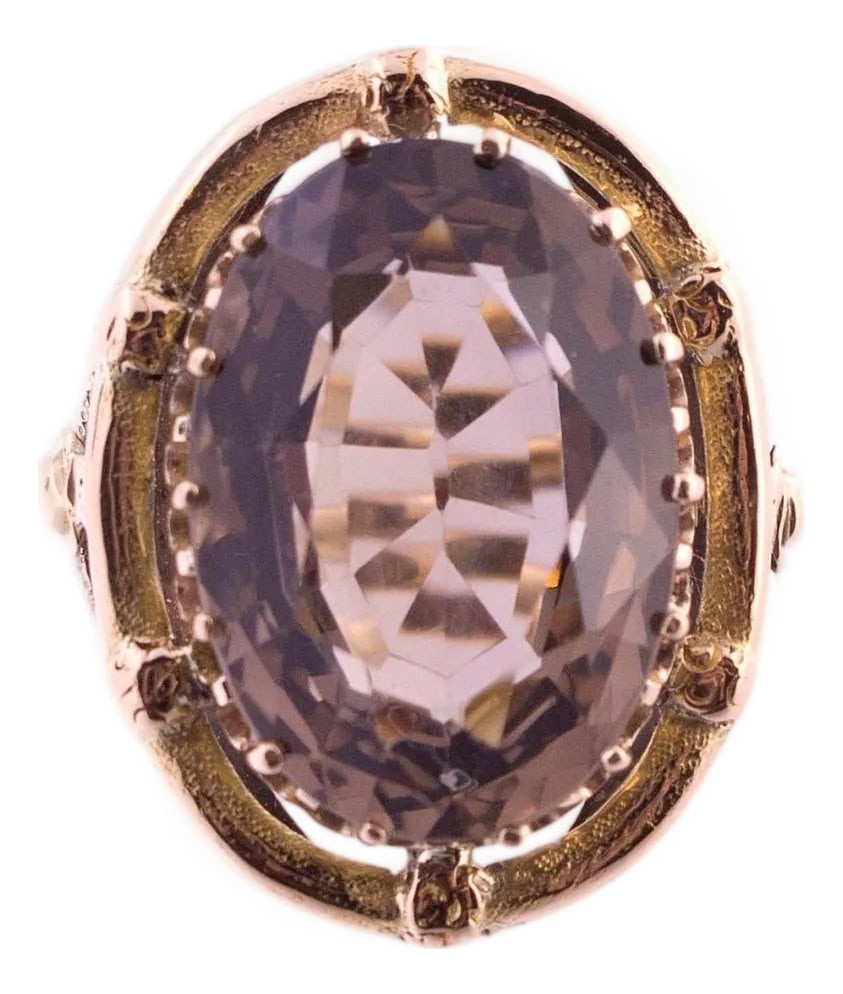 14k Gold Large Smoky Quartz Ring, Size 8: A 14k yellow gold ring featuring a large brown quartz stone, set in an oval design. The quartz is securely held by a series of prongs, enhancing its brilliance. The band is crafted in yellow gold,