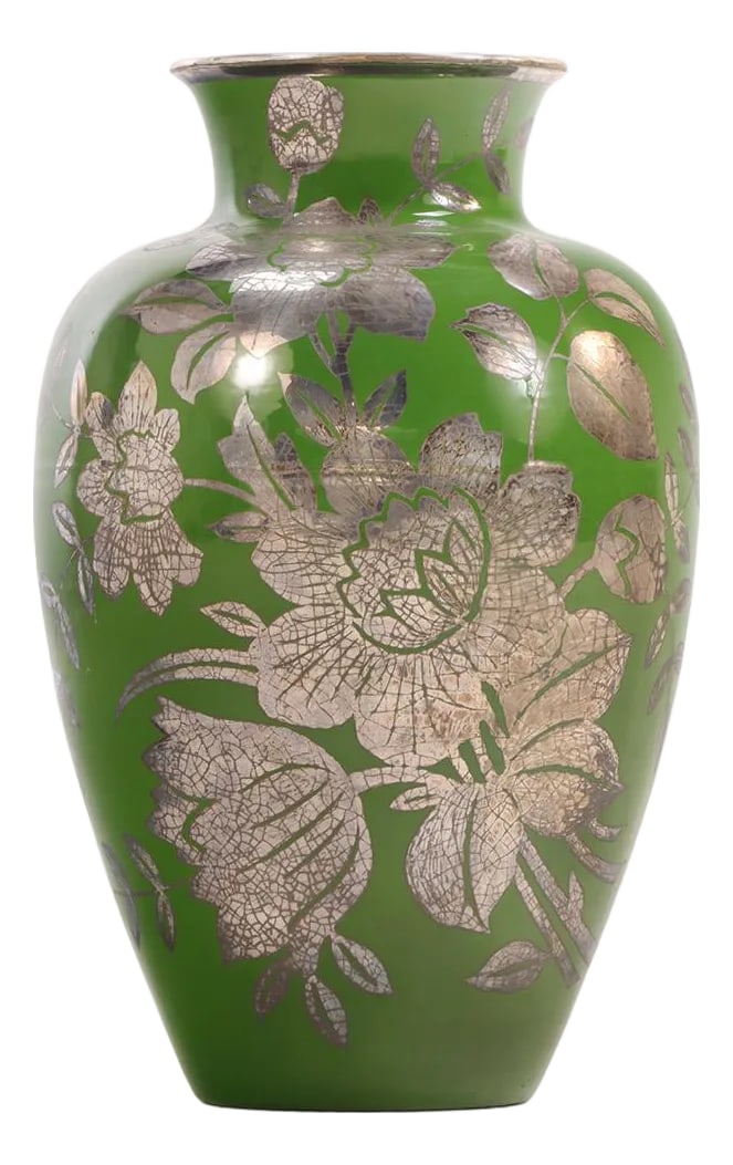 A Swedish Patinated Bronze Vase With Silver Overlay, 20th C.: This elegant vase features a classic baluster form, adorned with intricate floral motifs in silver overlay that stand out beautifully against its rich, deep green patinated bronze base. The