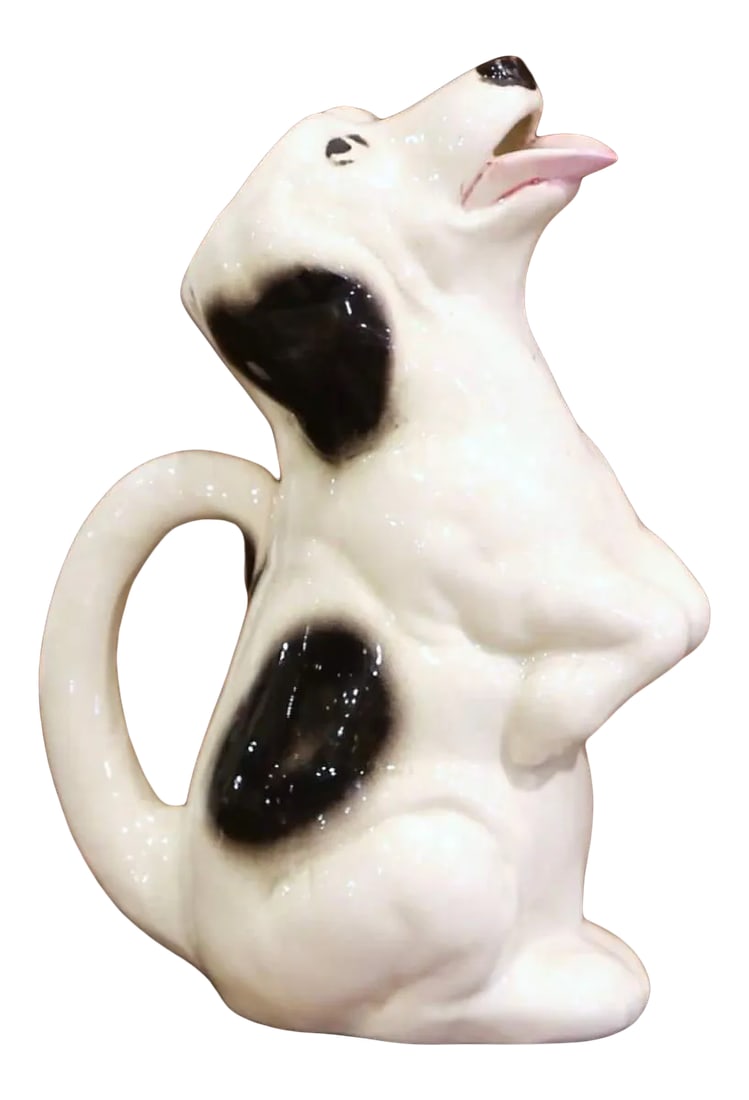 Mid-Century French Sarreguemines Hand-Painted Ceramic Begging Dog Pitcher: Full of personality, this vintage ceramic pitcher is modeled as a seated dog begging for a treat. Crafted in France circa 1950, the whimsical vessel bears a printed underside mark reading