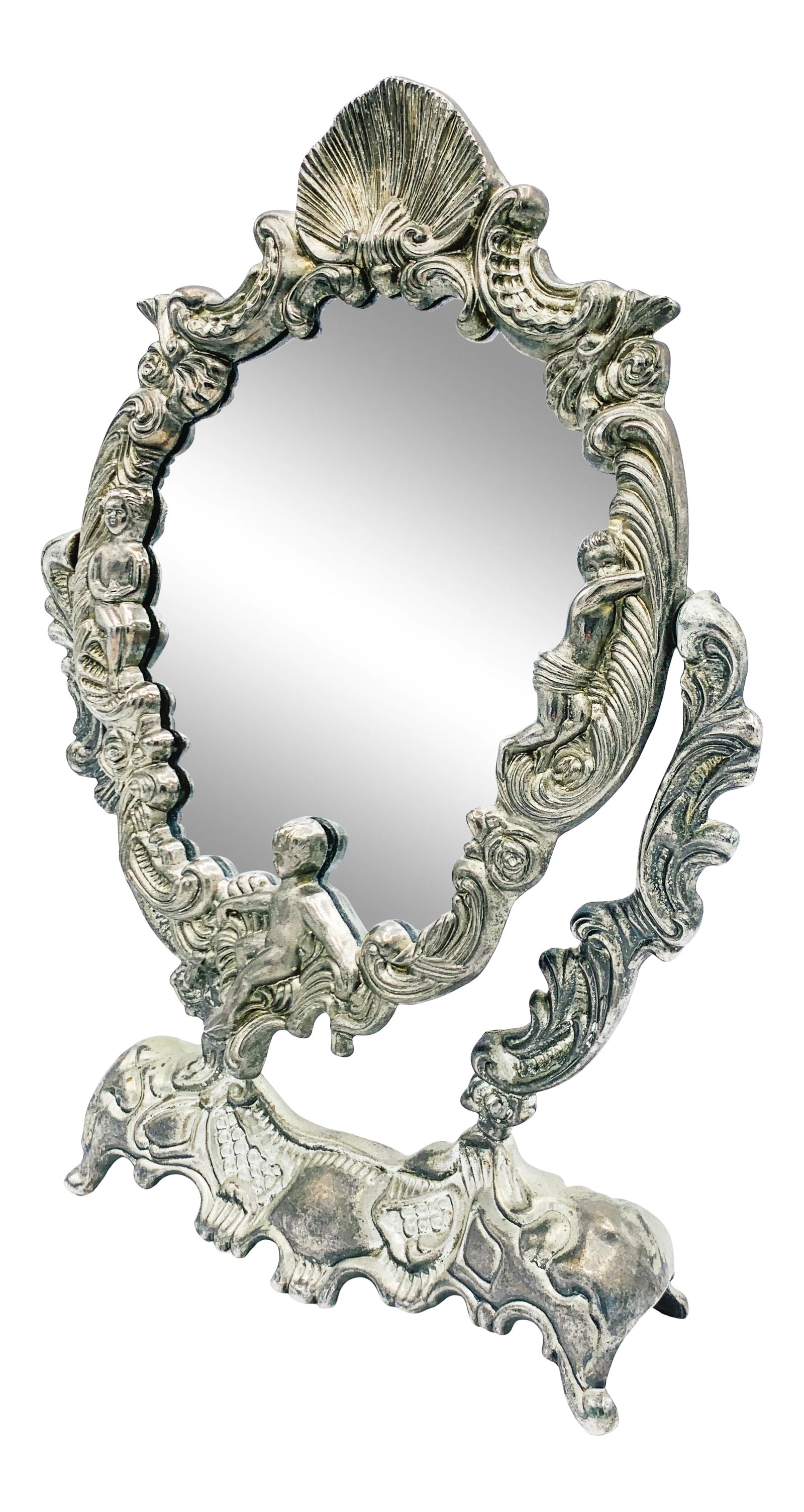 Art Nouveau French Dressing Table Mirror: This Art Nouveau Dressing Table Mirror is a sturdy, and elegant piece of decor from the past. The silver color is unique in vogue. This mirror would look great on top of a dressing table, or vanity