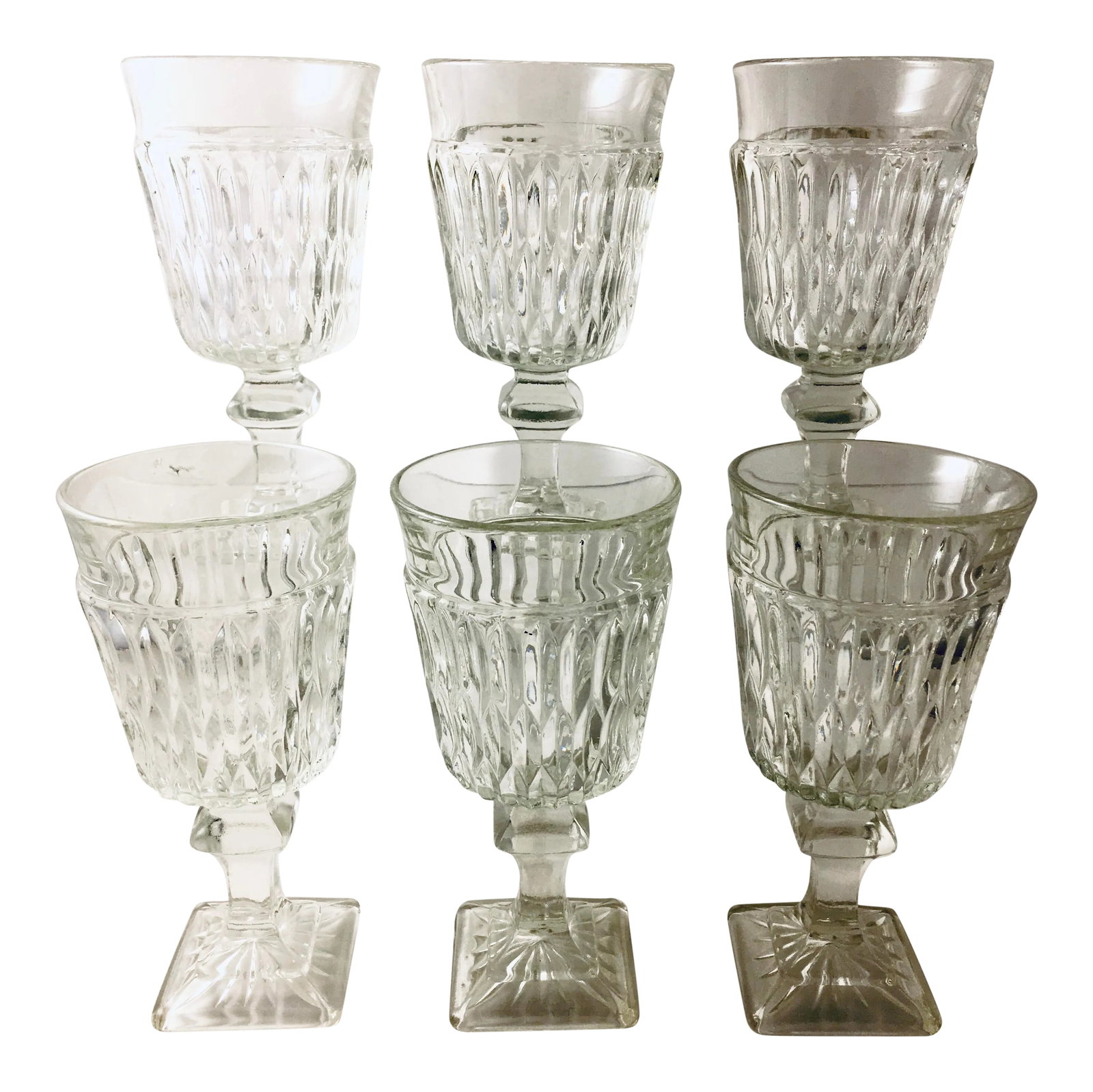 1940s Georgian Style Faceted Stemware - Set of 6: Heavily faceted and unique in design. Each glass sits on a unique square-shaped base with a sunburst pattern. The stems feature a faceted ball at their center. Dimensions: 2.5" x 2.5" x 5.5" Rustic